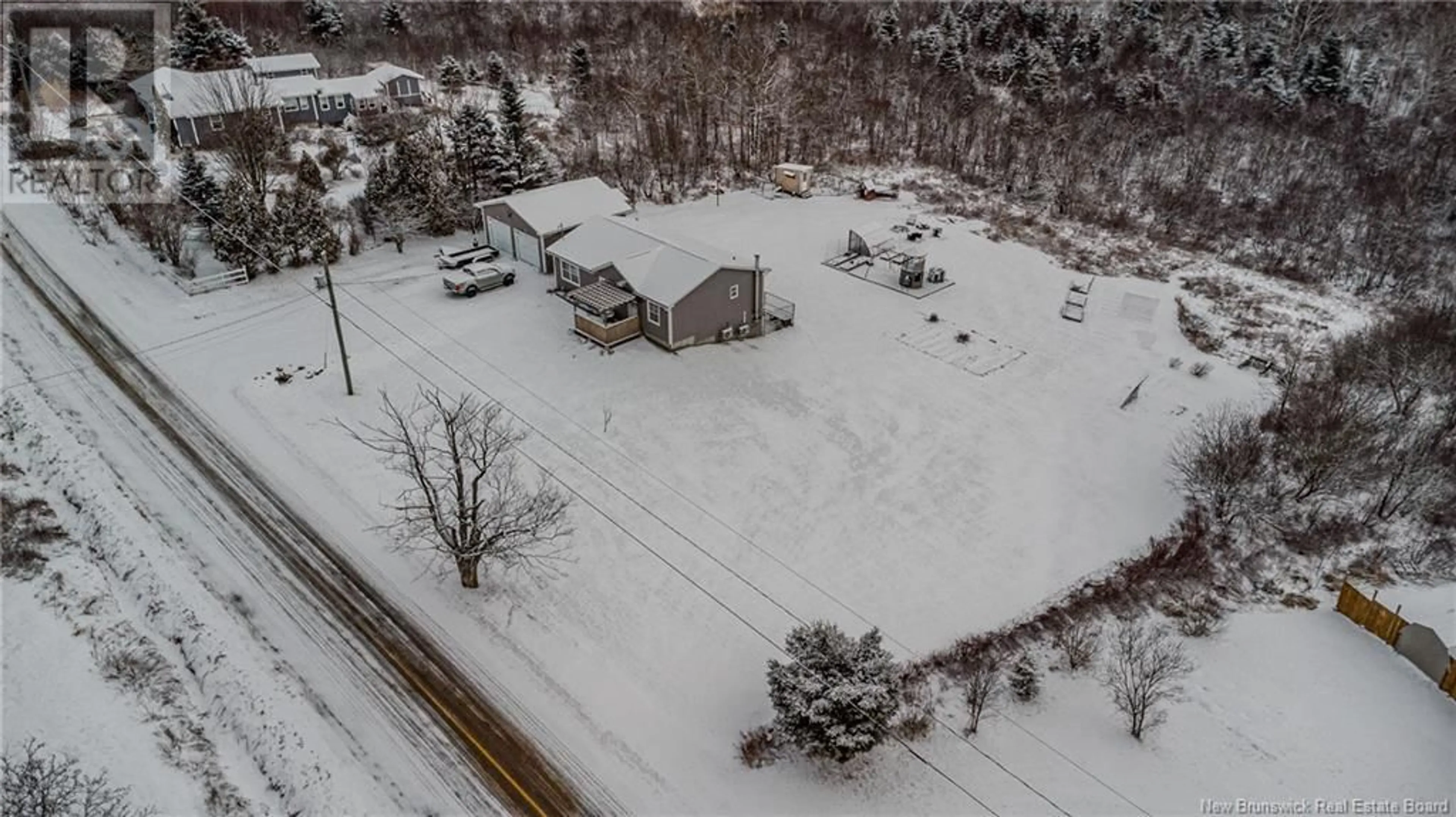 A pic from outside/outdoor area/front of a property/back of a property/a pic from drone, street for 136 Hill Road, Kingston New Brunswick E5N1H7