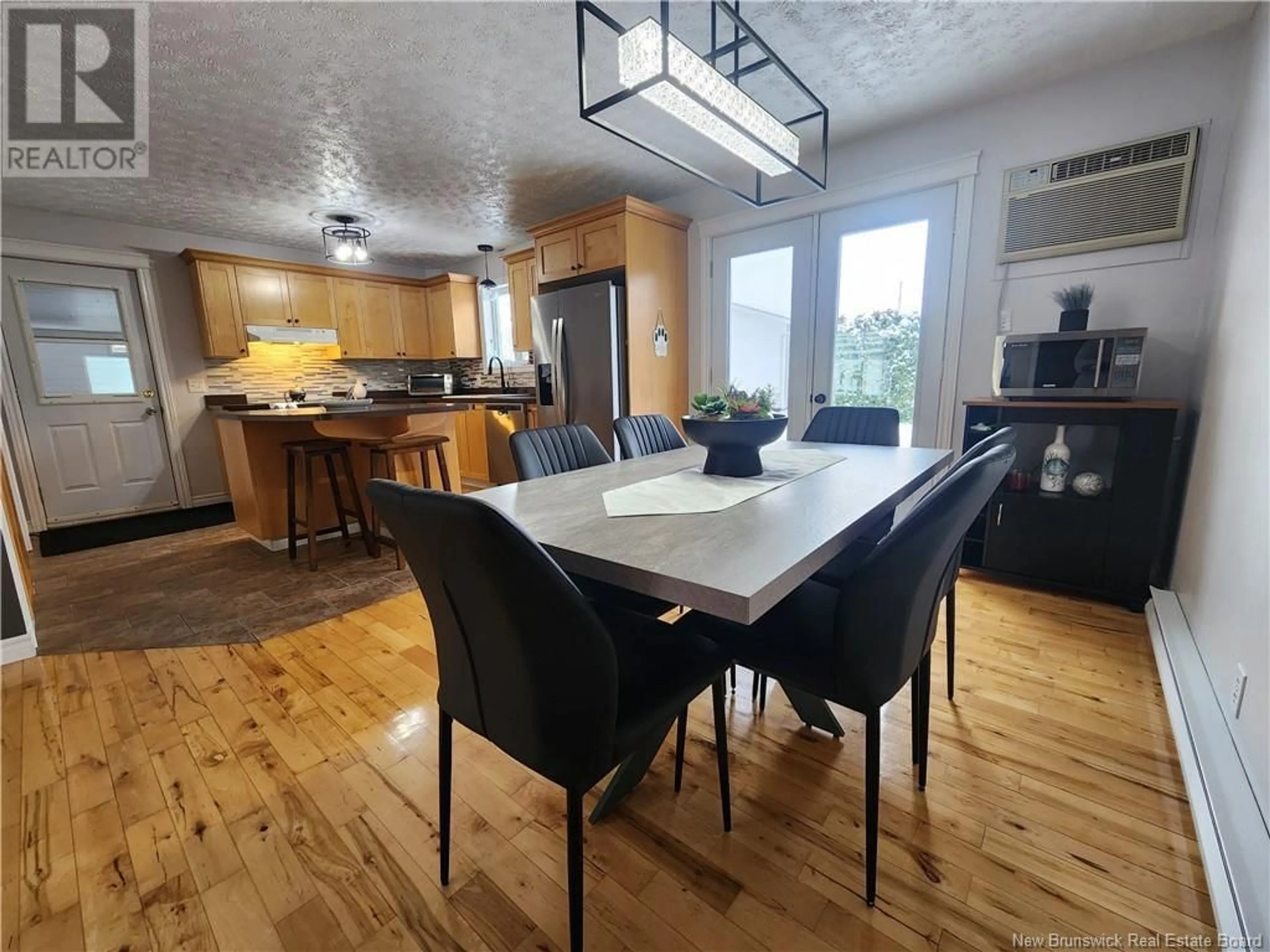 Open concept kitchen, wood/laminate floor for 110 Theriault Street, Drummond New Brunswick E3Y2N4