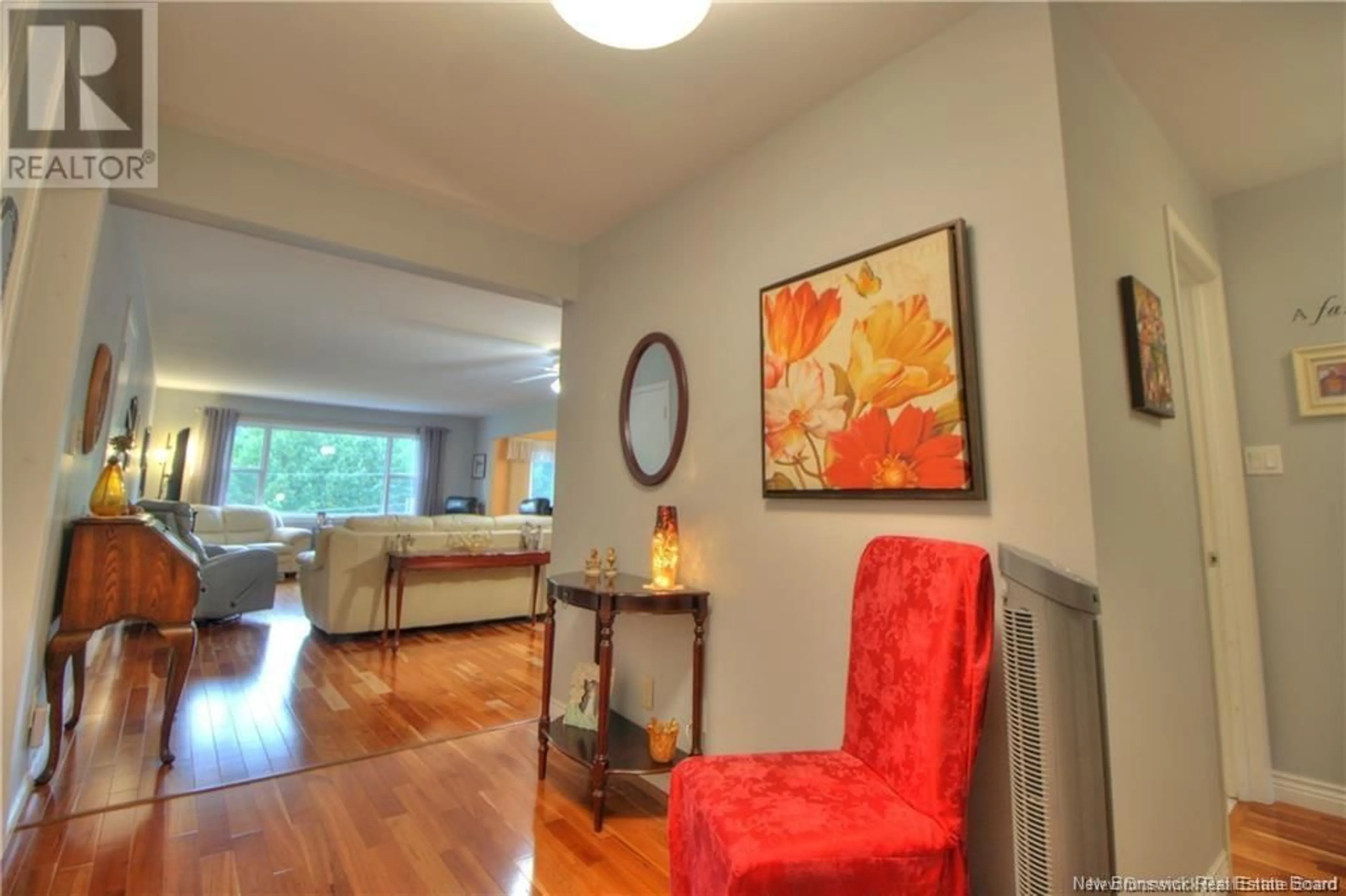 Living room with furniture, wood/laminate floor for 79 Kendra Street Unit# 3, Moncton New Brunswick E1C8V8