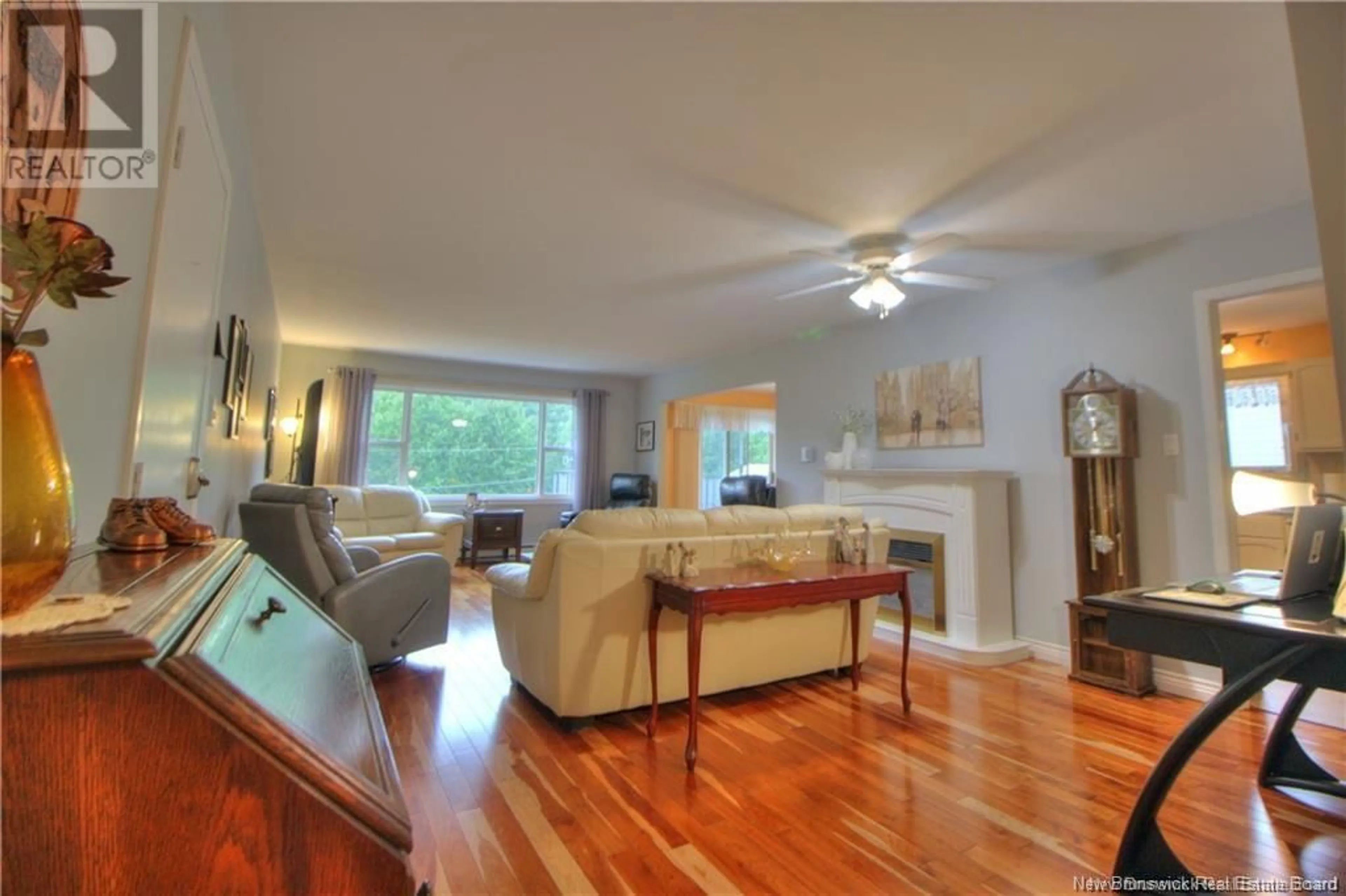 Living room with furniture, wood/laminate floor for 79 Kendra Street Unit# 3, Moncton New Brunswick E1C8V8