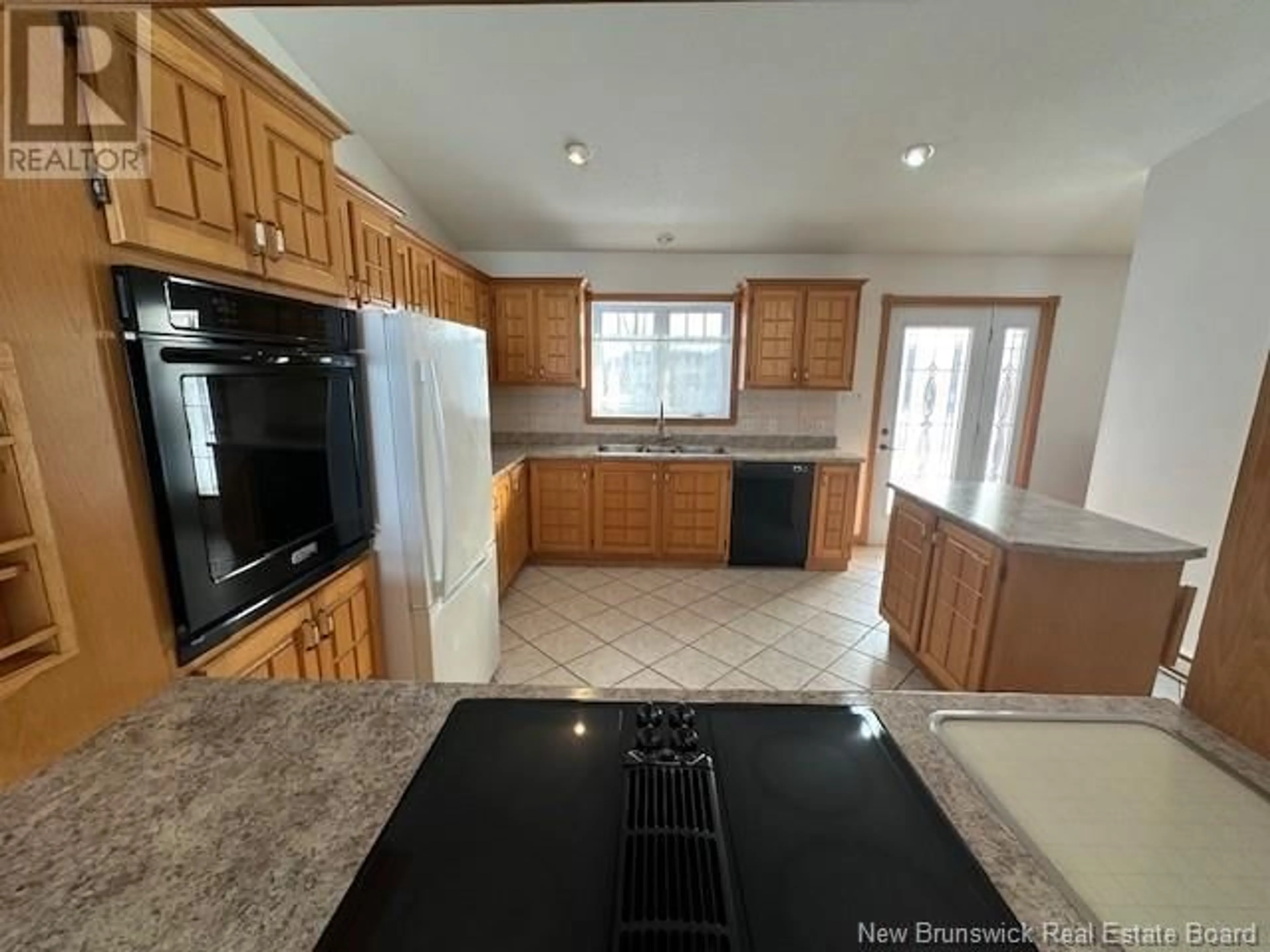 Open concept kitchen, ceramic/tile floor for 1637 Des Pionniers Avenue, Balmoral New Brunswick E8E1C1