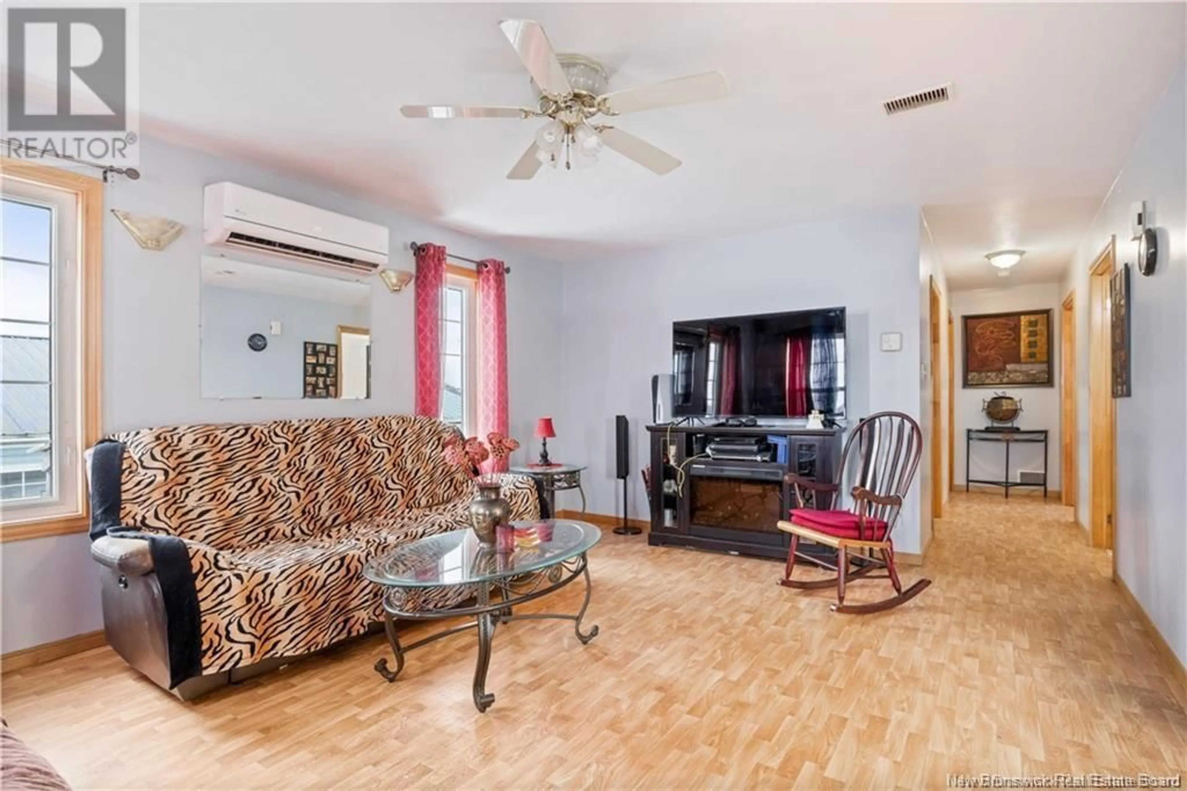 Living room with furniture, wood/laminate floor for 8239 ROUTE 117, Black River Bridge New Brunswick E1N5K4