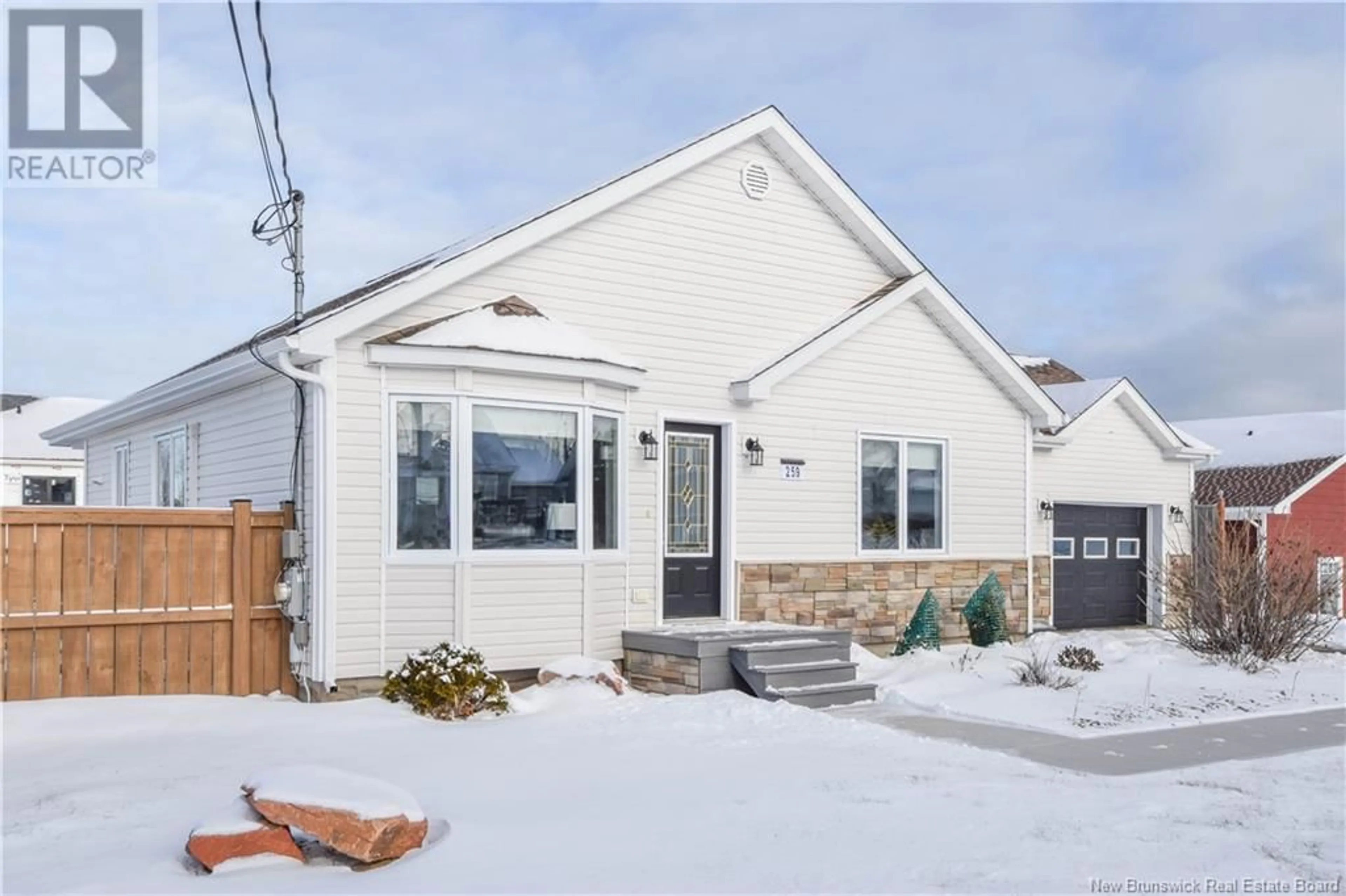 Home with vinyl exterior material, street for 259 rue Savard Street, Caraquet New Brunswick E1W1A4