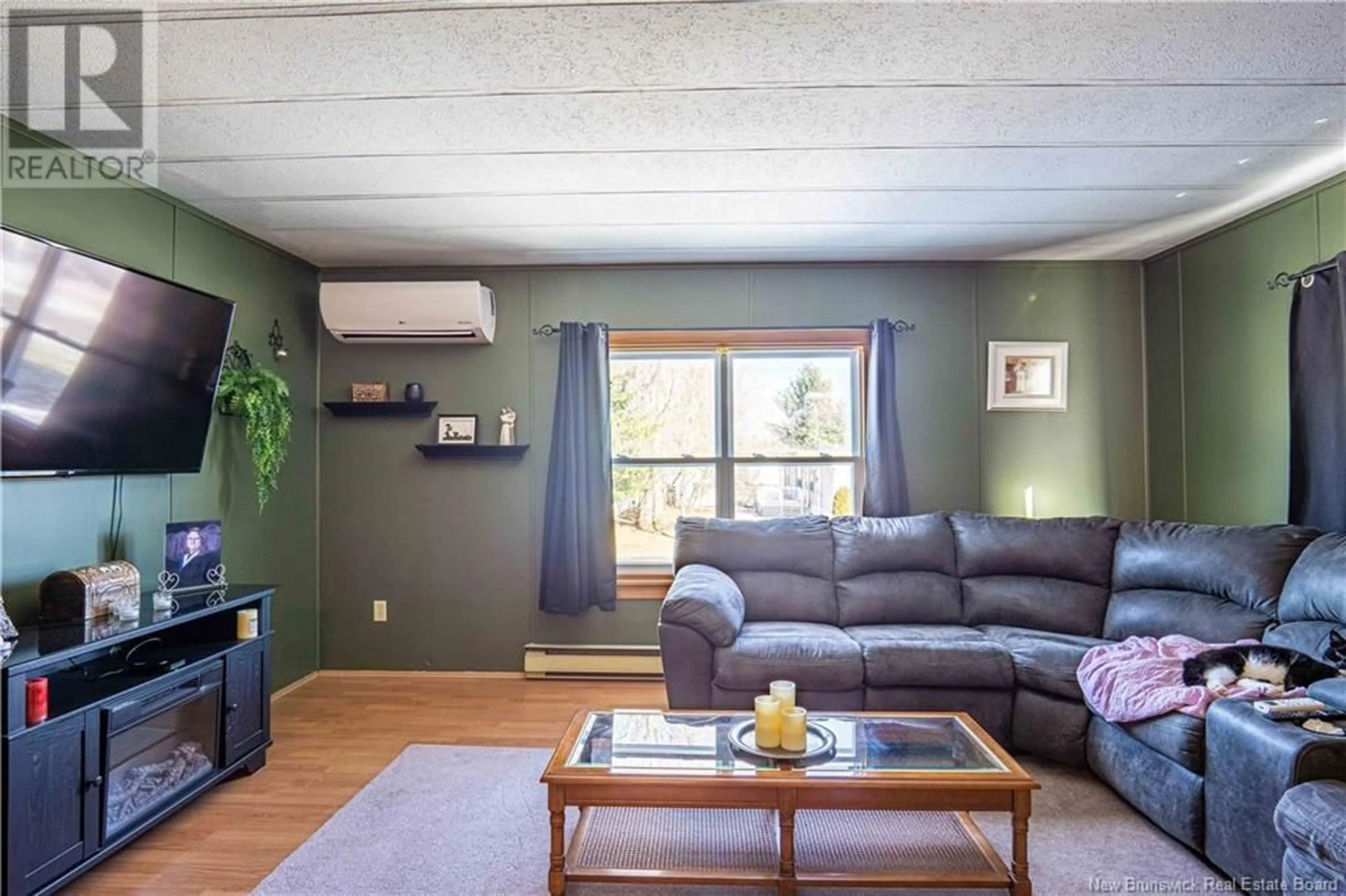 Living room with furniture, wood/laminate floor for 5 Leslee Drive, Lincoln New Brunswick E3B6W7