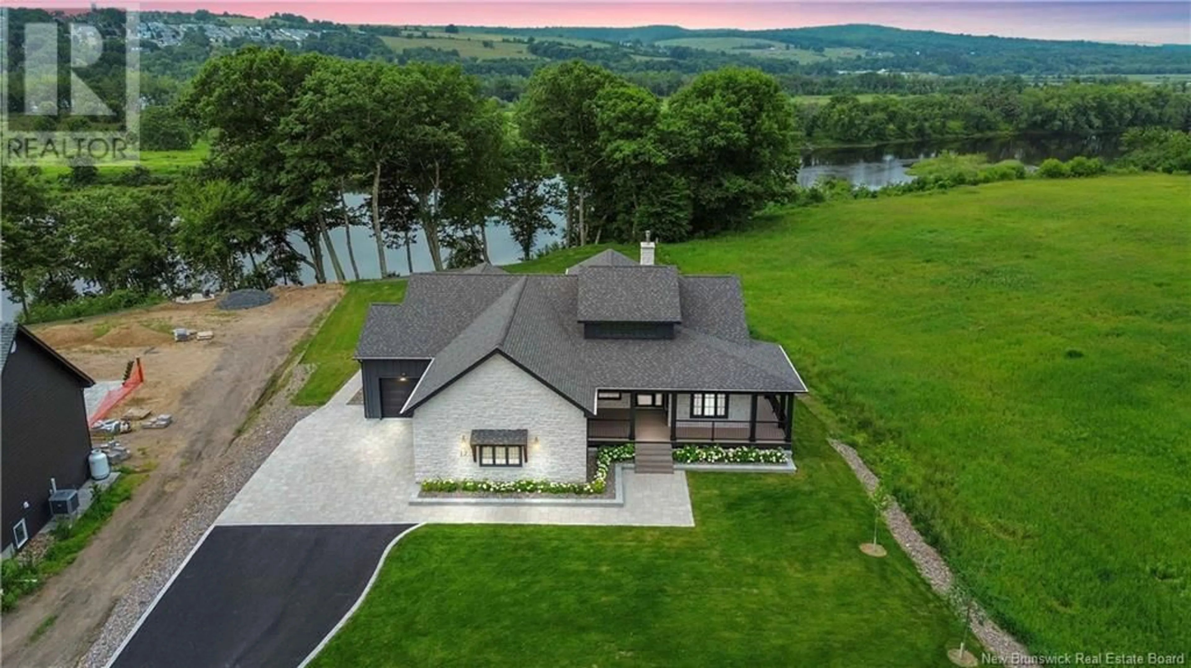 A pic from outside/outdoor area/front of a property/back of a property/a pic from drone, water/lake/river/ocean view for 17 Blake Court, Fredericton New Brunswick E3G7K9