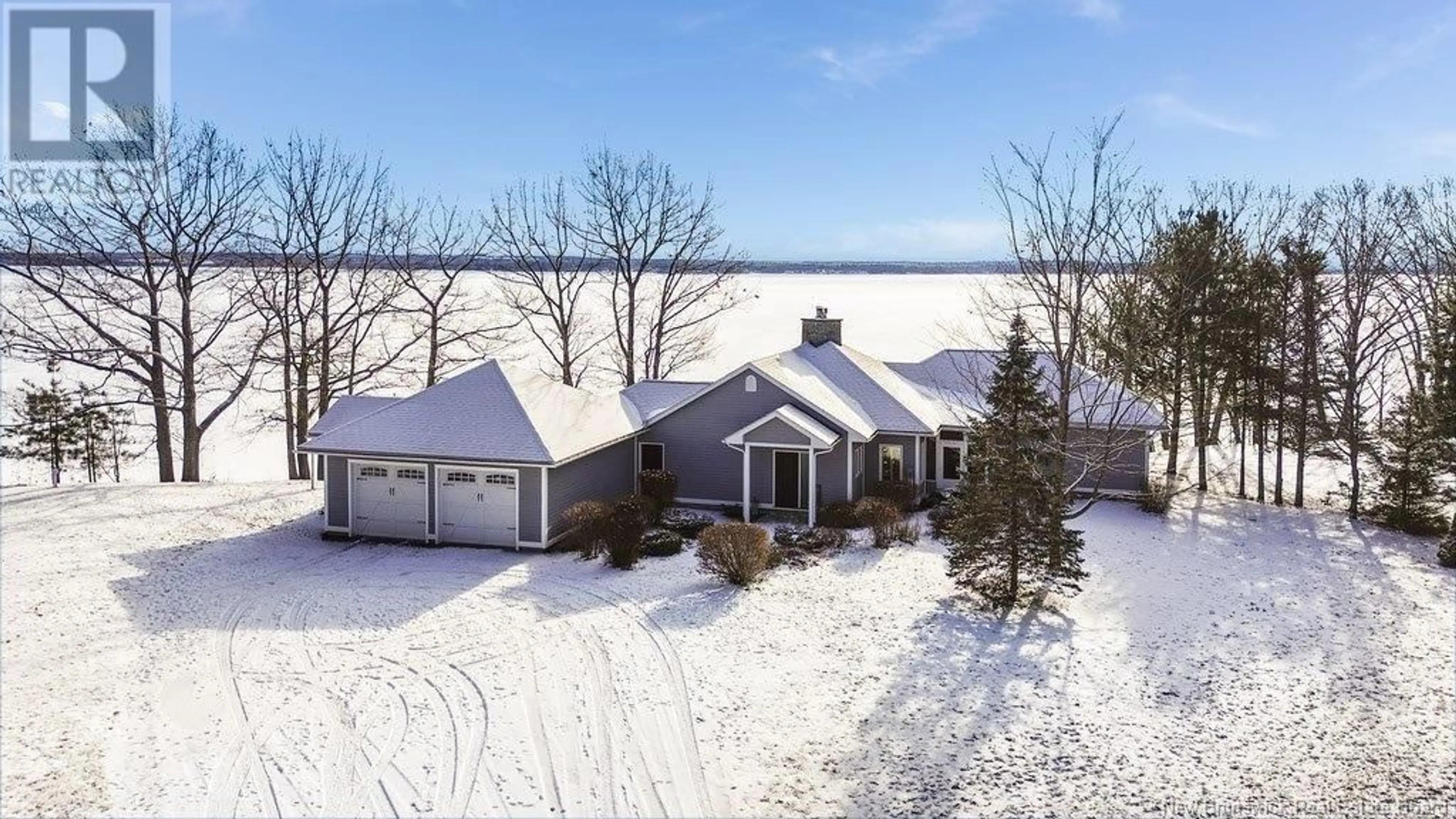 A pic from outside/outdoor area/front of a property/back of a property/a pic from drone, water/lake/river/ocean view for 18 Cottage Lane, Grand Lake New Brunswick E4B0B5