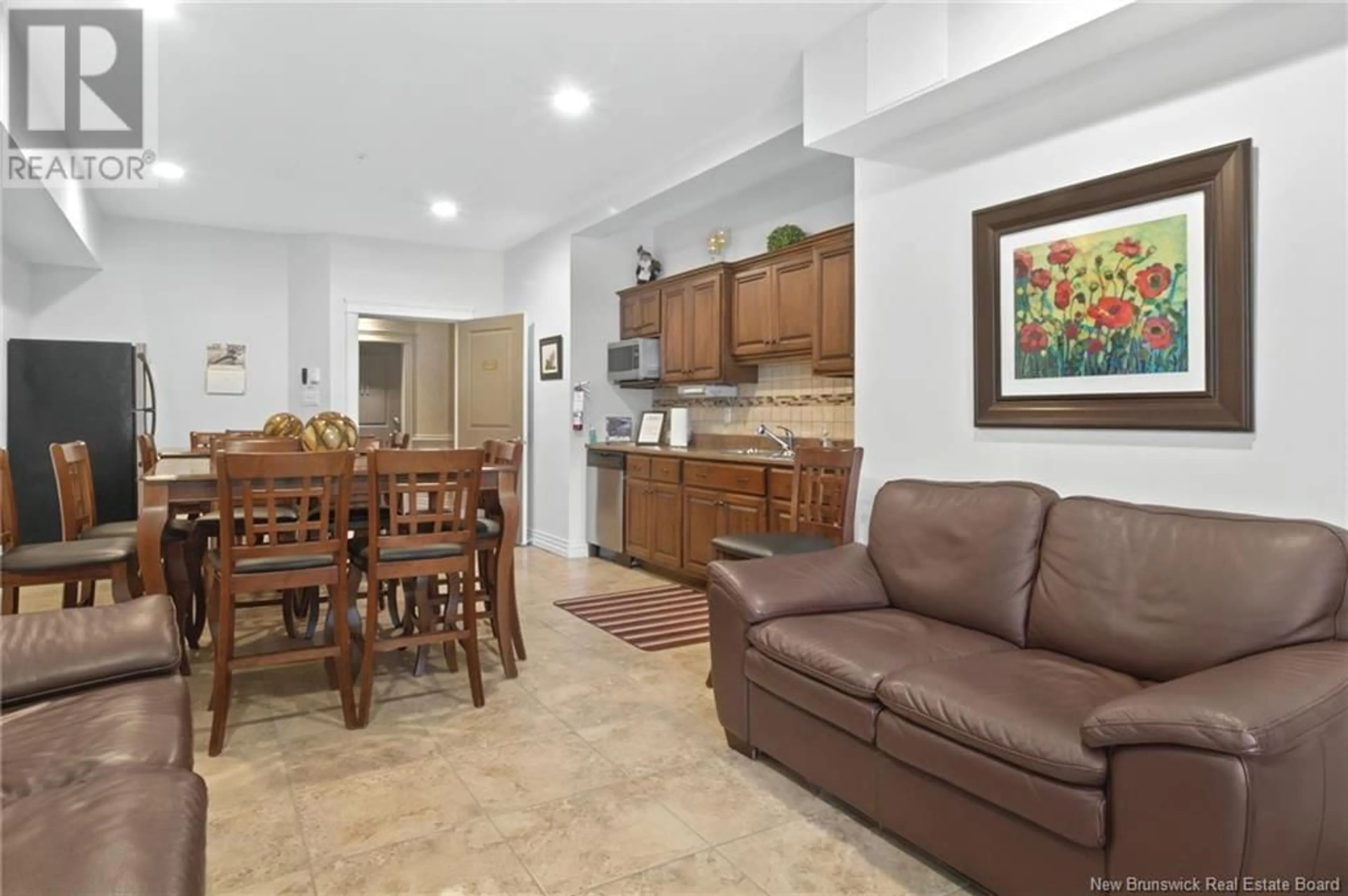 Living room with furniture, ceramic/tile floor for 65 Diamond Head Court Unit# 405, Moncton New Brunswick E1G0V6