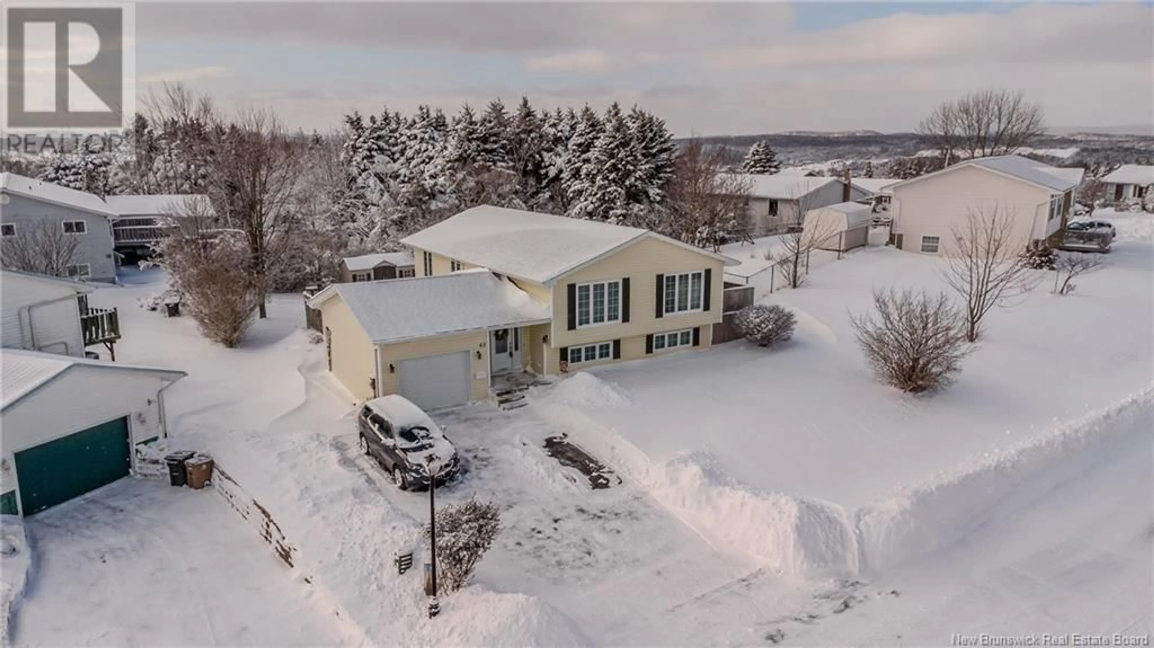 A pic from outside/outdoor area/front of a property/back of a property/a pic from drone, street for 62 Vista Ridge Crescent, Saint John New Brunswick E2J5A7