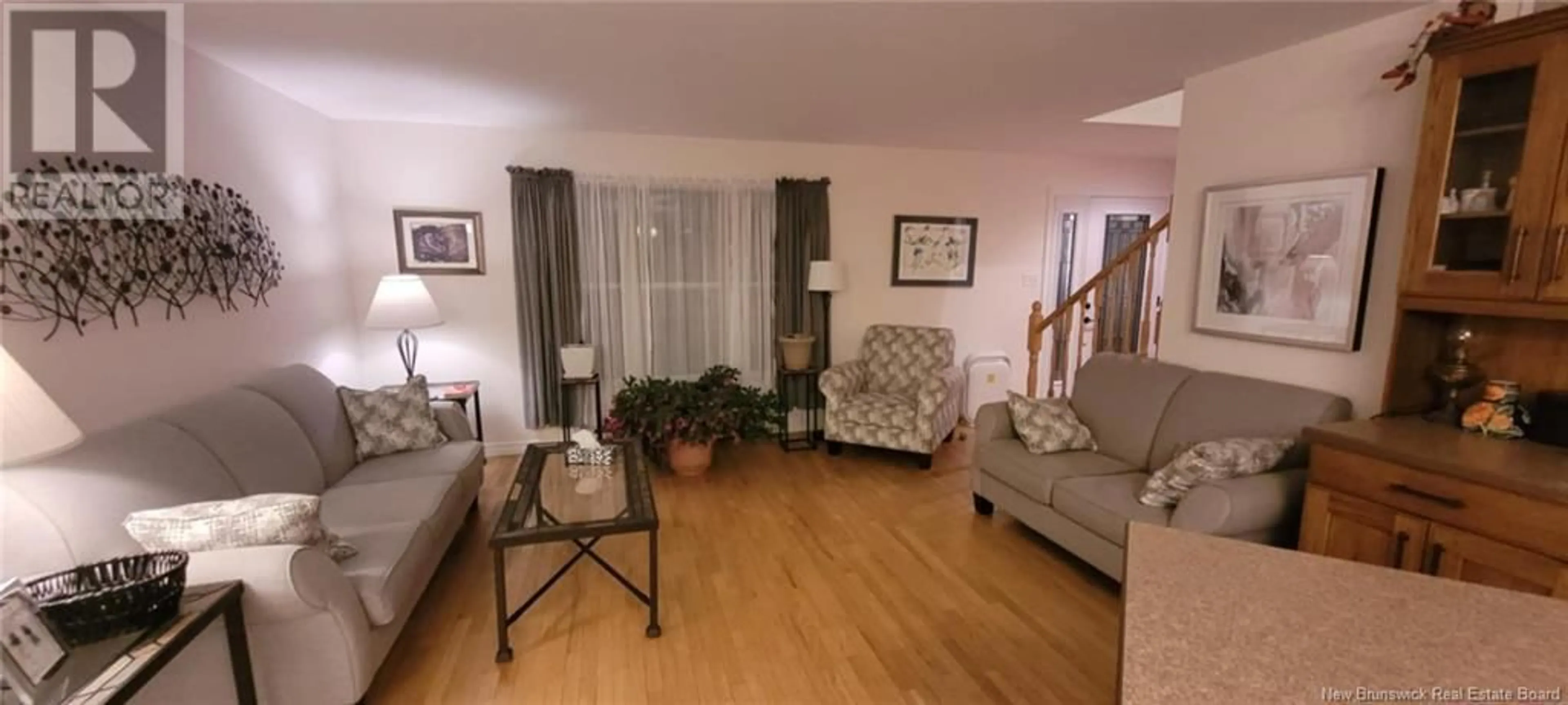 Living room with furniture, wood/laminate floor for 112 tipperary, Shediac New Brunswick E4P2V9