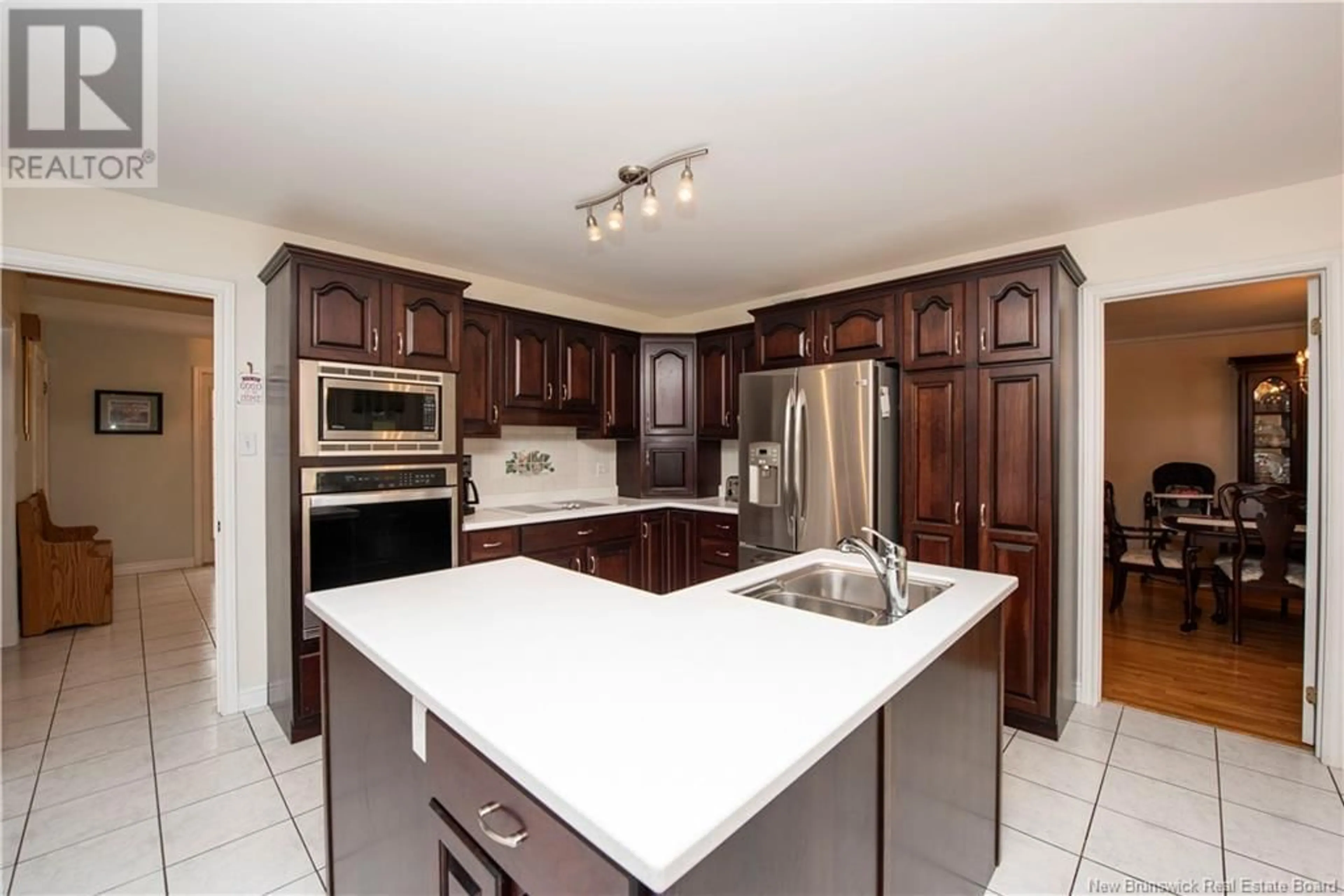 Open concept kitchen, ceramic/tile floor for 20 Spruce Grove Boulevard, Moncton New Brunswick E1A6Y8