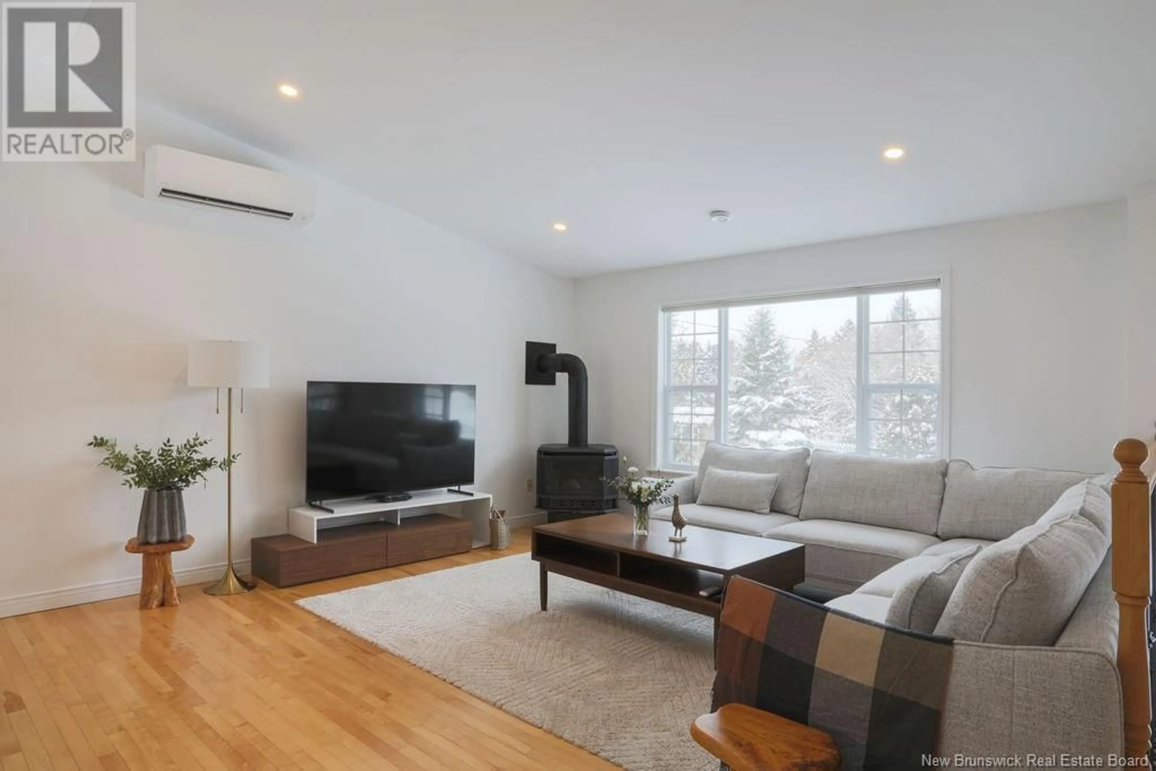 Living room with furniture, wood/laminate floor for 9 Catherine Avenue, Quispamsis New Brunswick E2E4N7