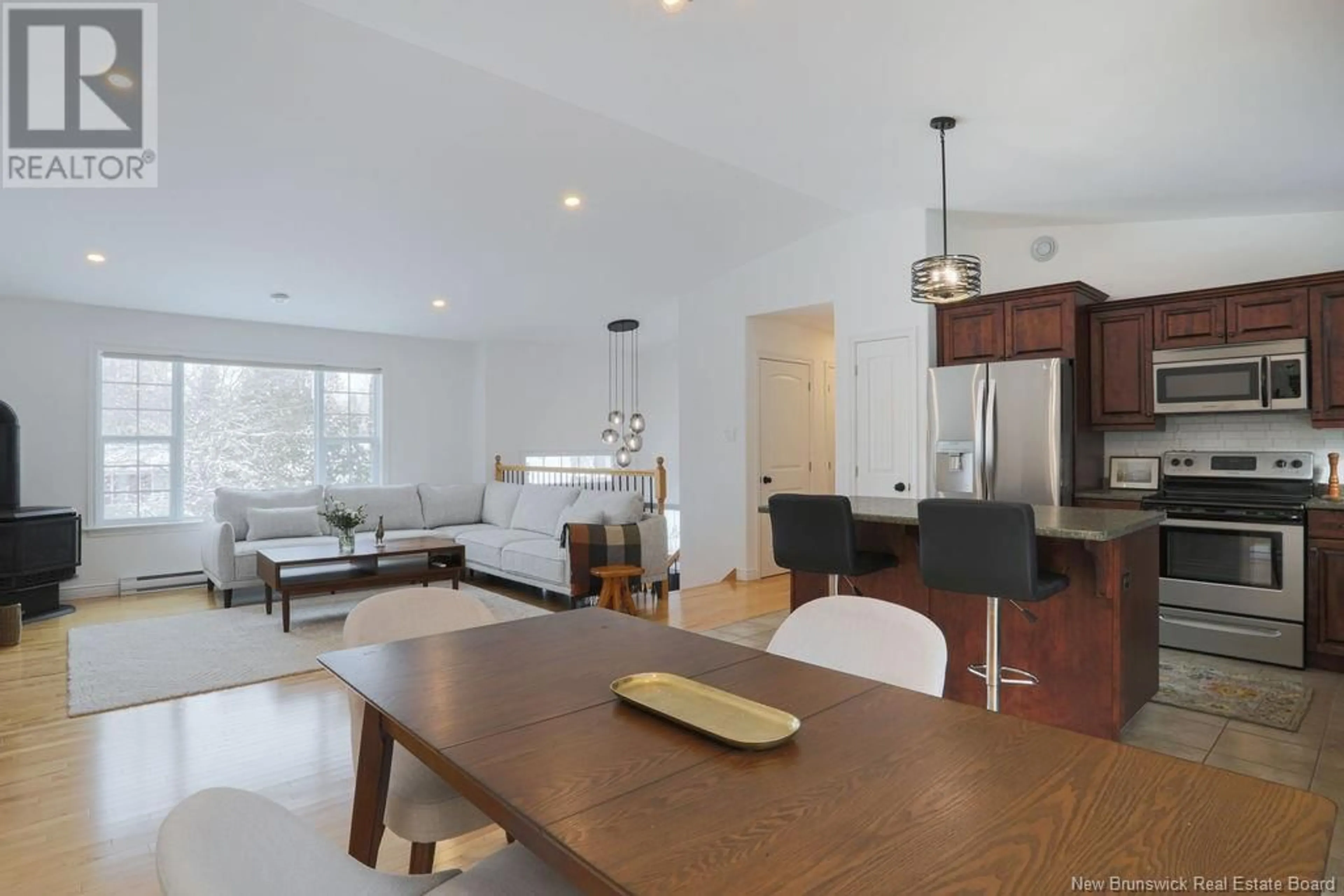 Open concept kitchen, wood/laminate floor for 9 Catherine Avenue, Quispamsis New Brunswick E2E4N7