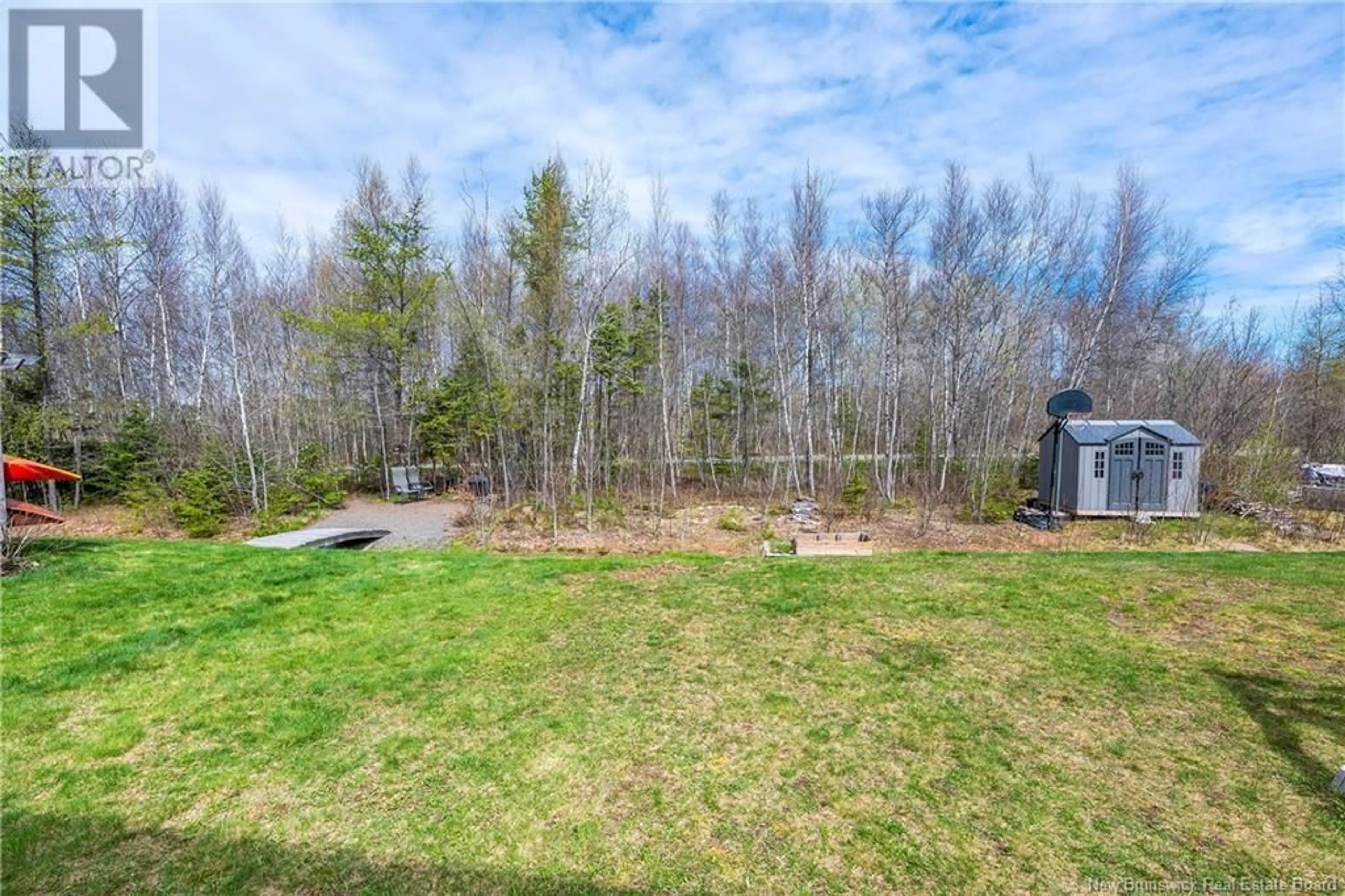 A pic from outside/outdoor area/front of a property/back of a property/a pic from drone, forest/trees view for 343 DOLBEAU STREET, Dieppe New Brunswick E1A4H8