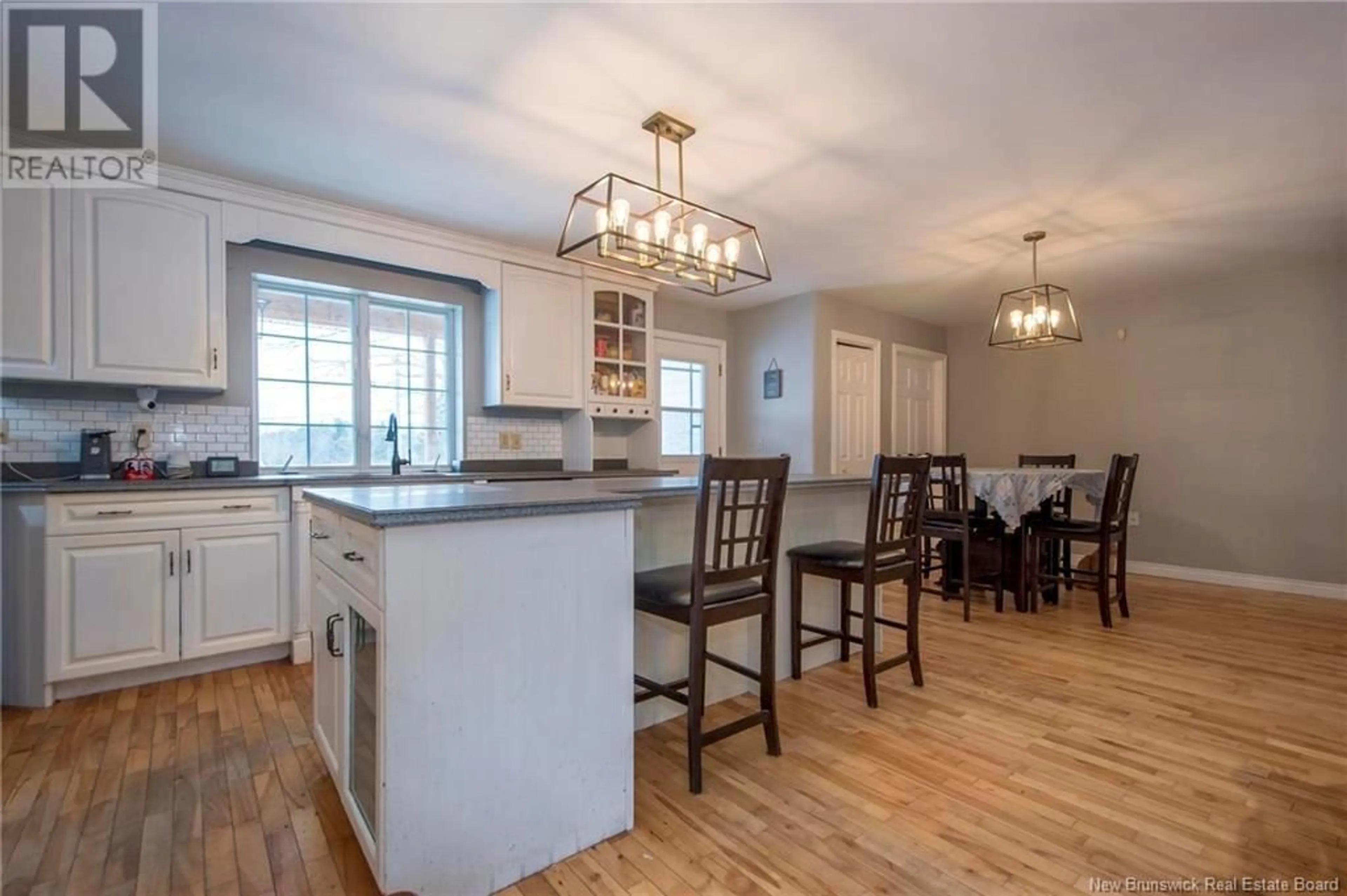 Open concept kitchen, wood/laminate floor for 899 Route 170, Oak Bay New Brunswick E3L4A7