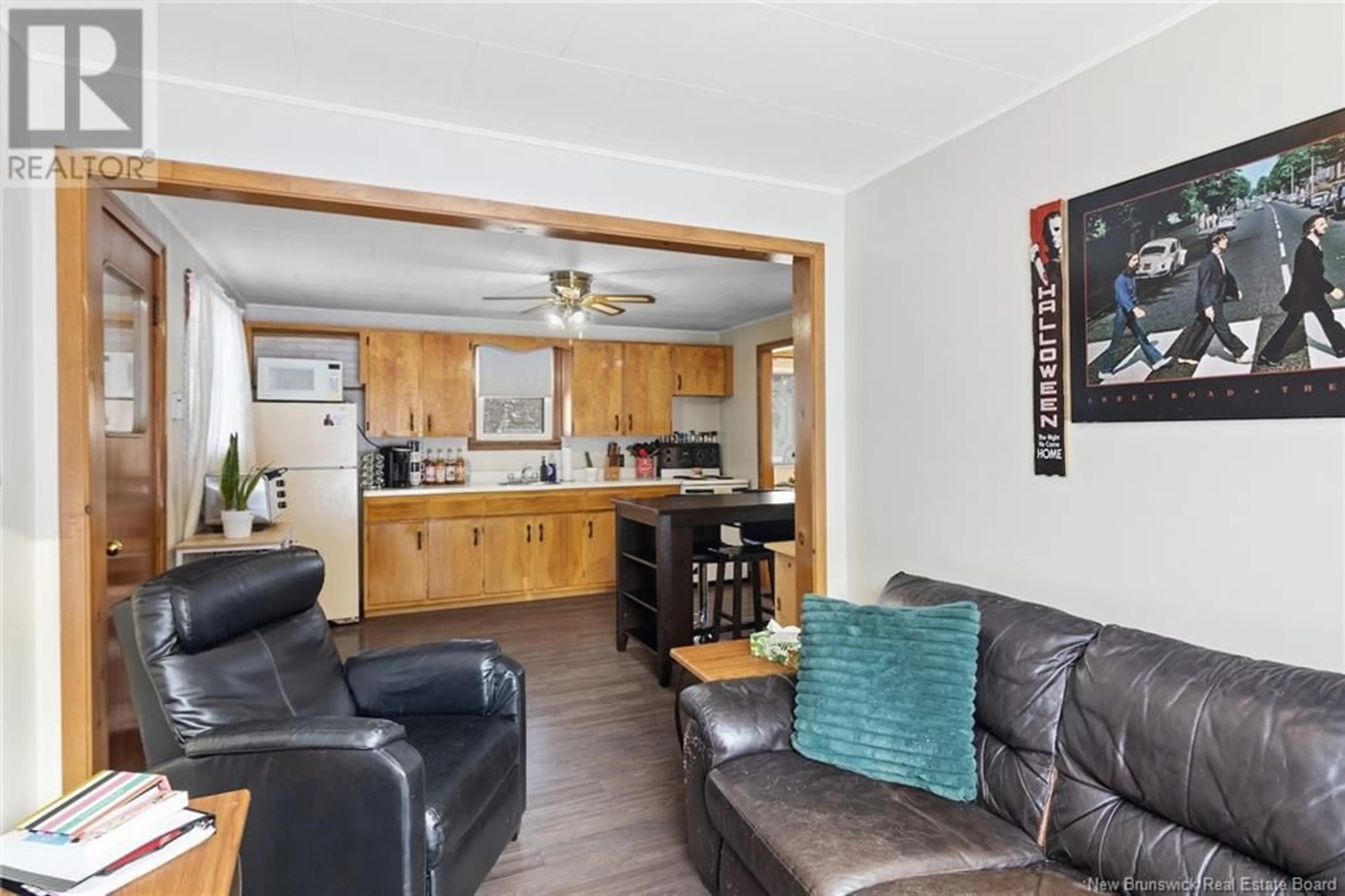 Living room with furniture, wood/laminate floor for 76 Red Bank Drive, Chipman New Brunswick E4A2A2