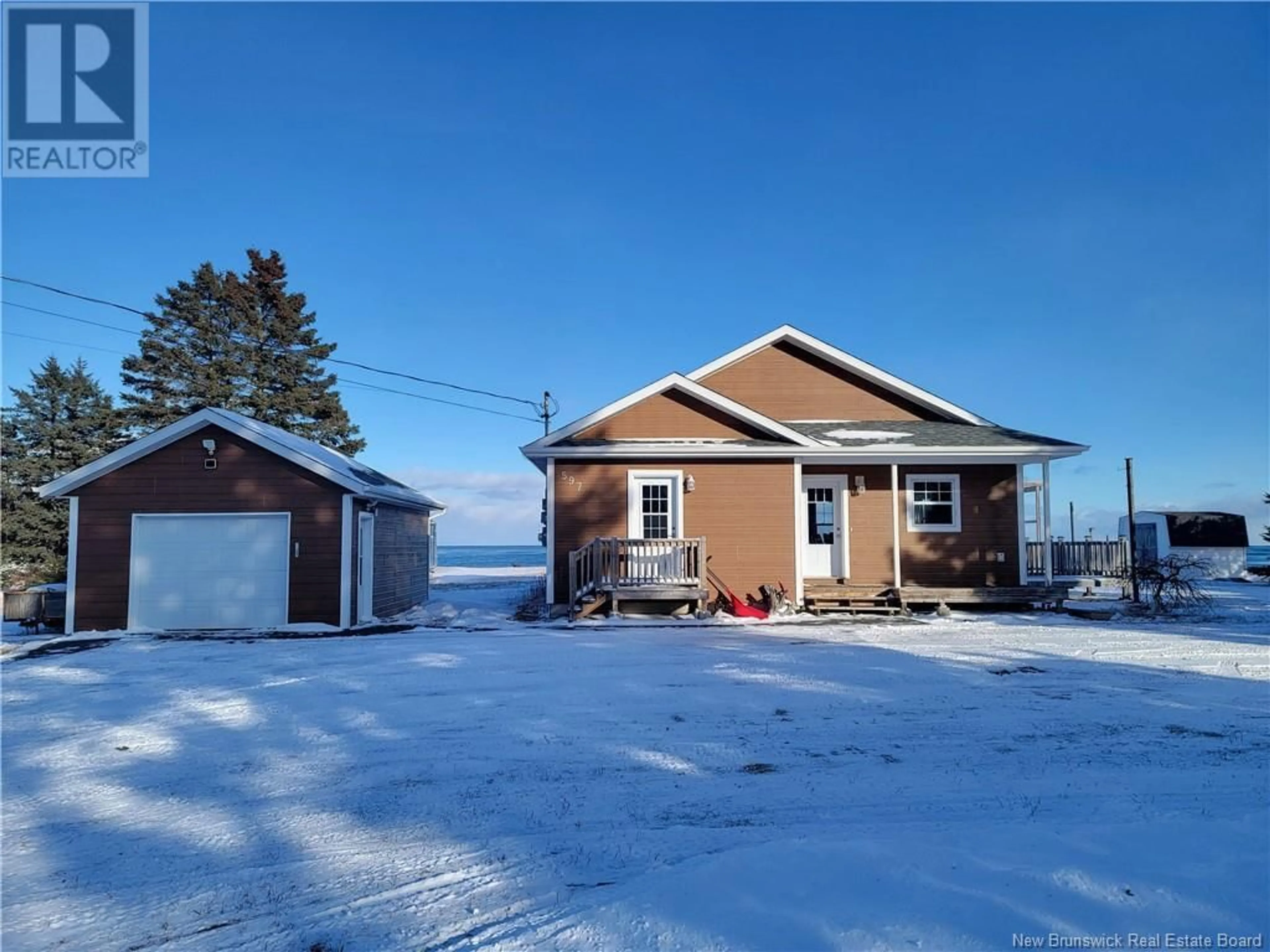 A pic from outside/outdoor area/front of a property/back of a property/a pic from drone, water/lake/river/ocean view for 597 Principale, Pointe-Verte New Brunswick E8J2P8