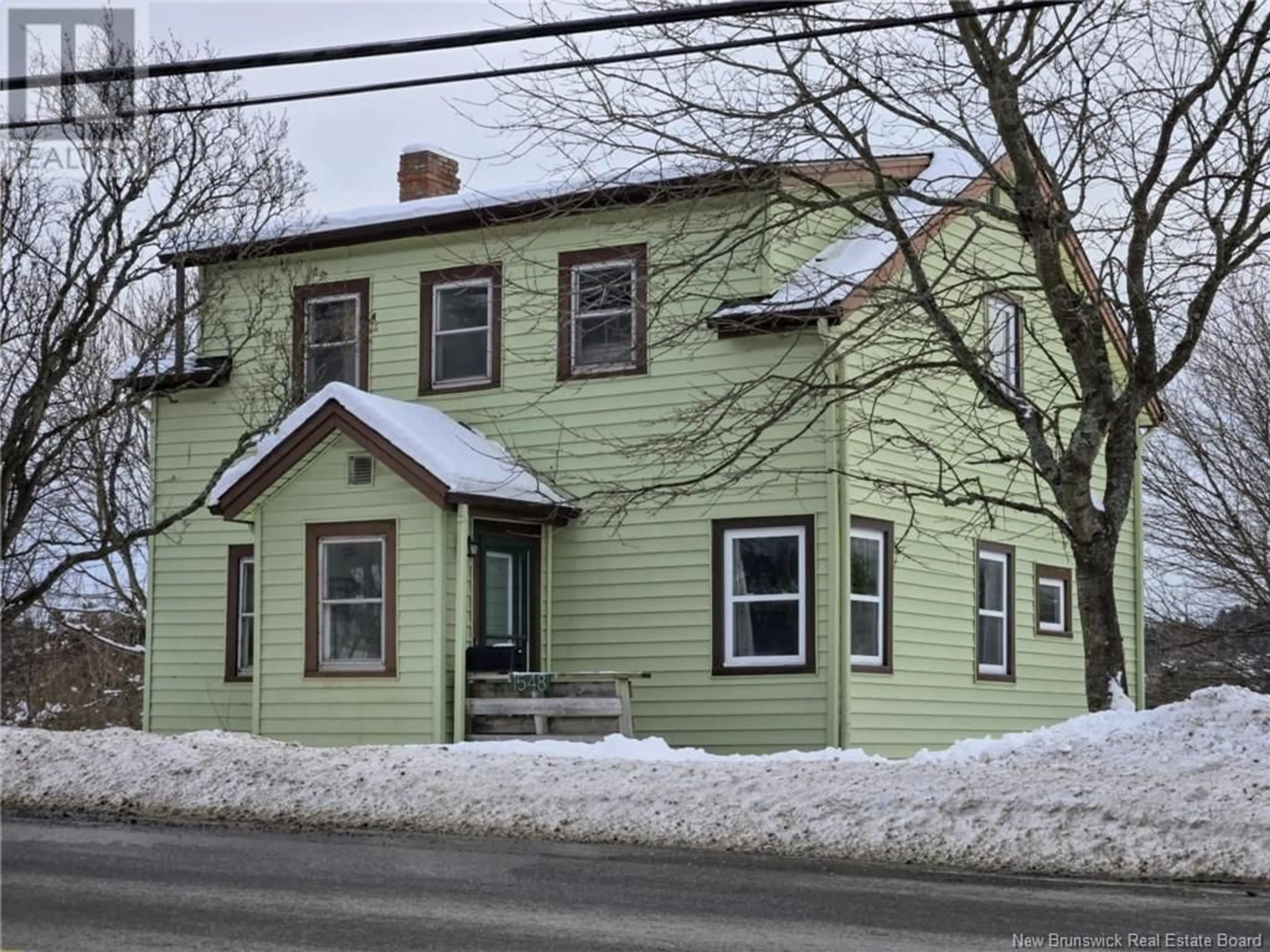 Home with vinyl exterior material, street for 1548 Loch Lomond Road, Saint John New Brunswick E2J1Z7