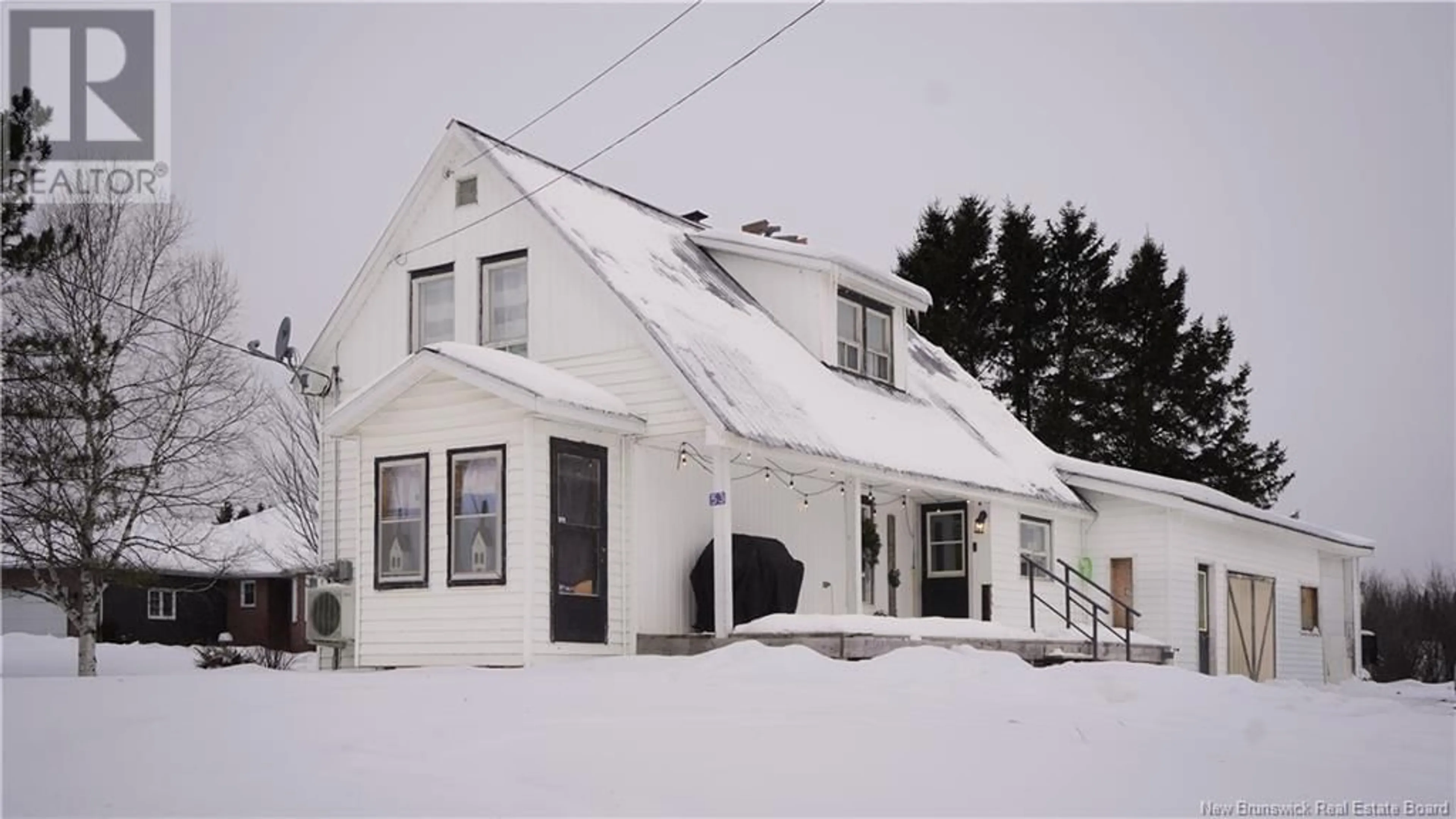 Home with vinyl exterior material, street for 53 Main Street, Linton Corner New Brunswick E7G2H3