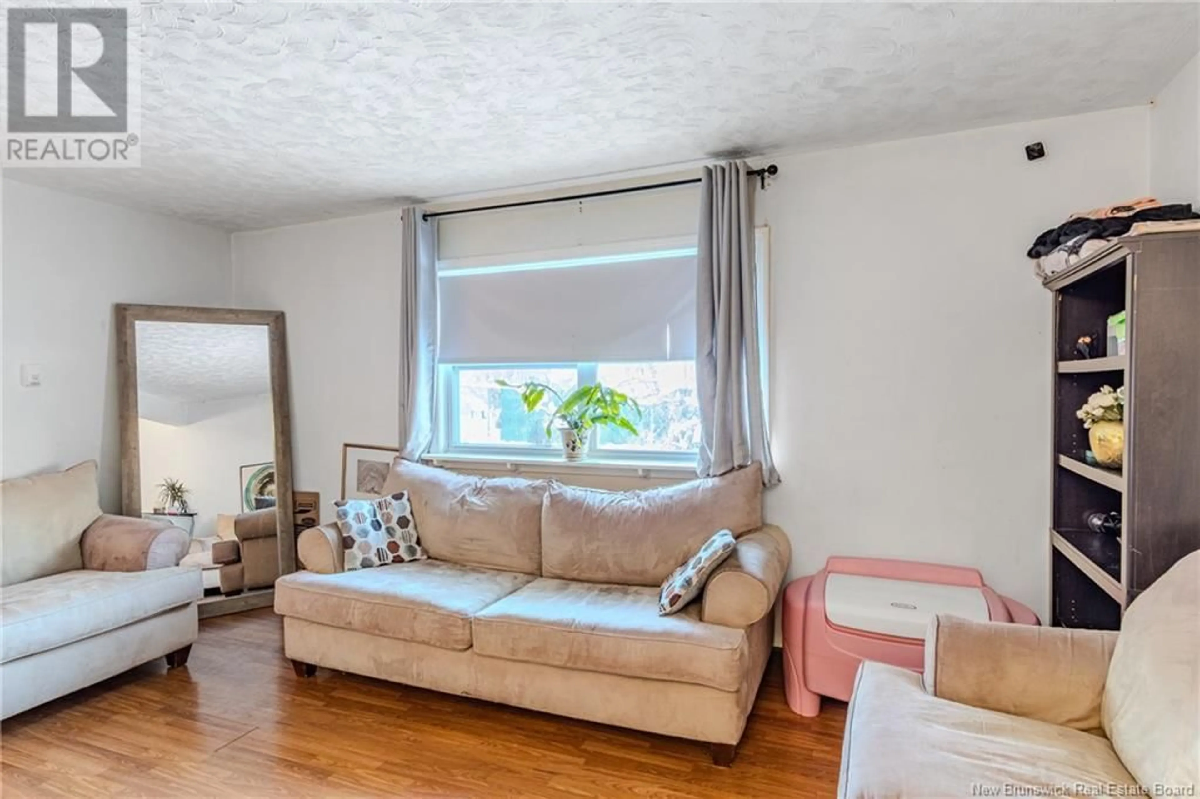 Living room with furniture, wood/laminate floor for 310 Tartan Street, Saint John New Brunswick E2K2R7