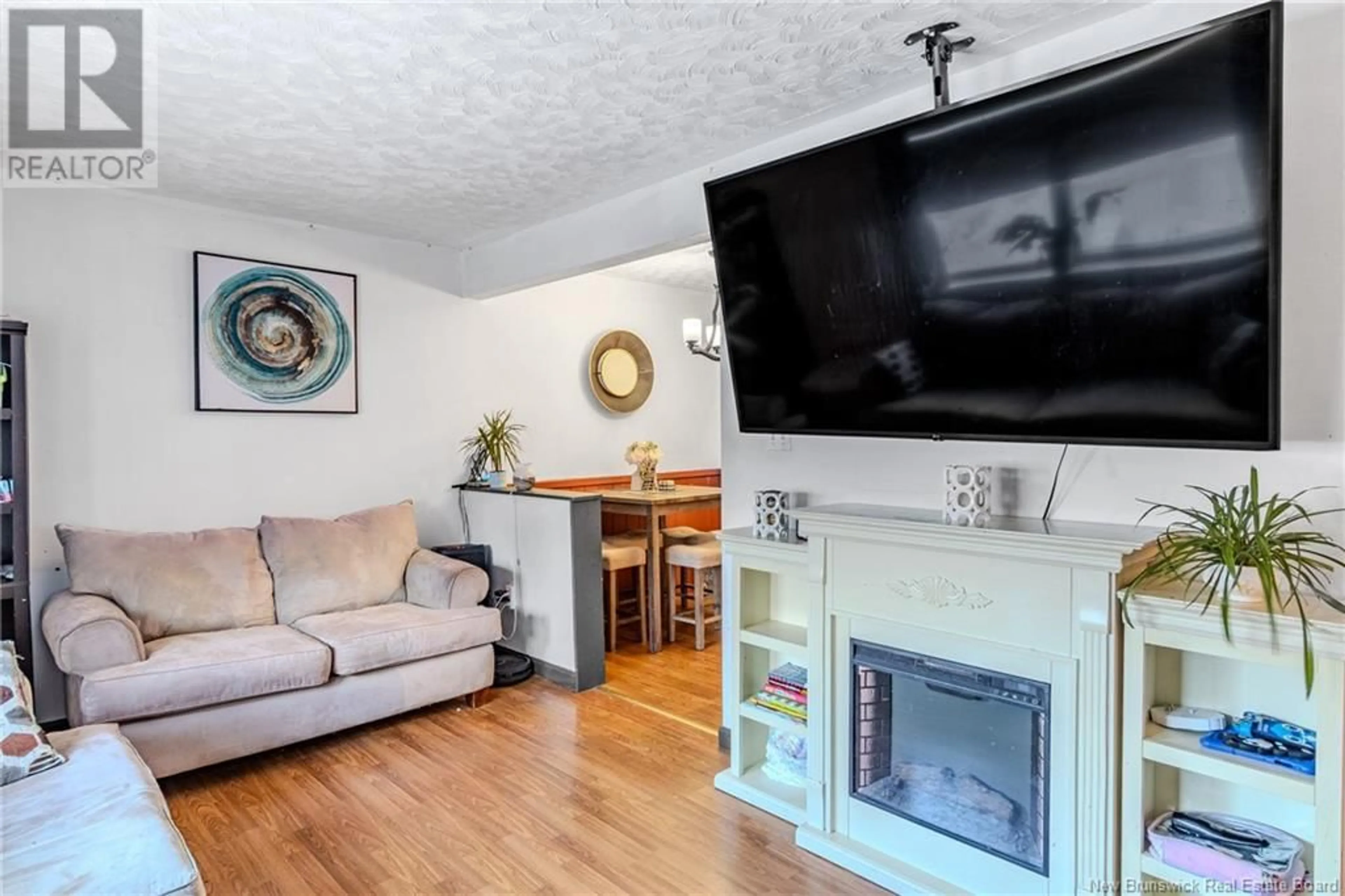 Living room with furniture, wood/laminate floor for 310 Tartan Street, Saint John New Brunswick E2K2R7