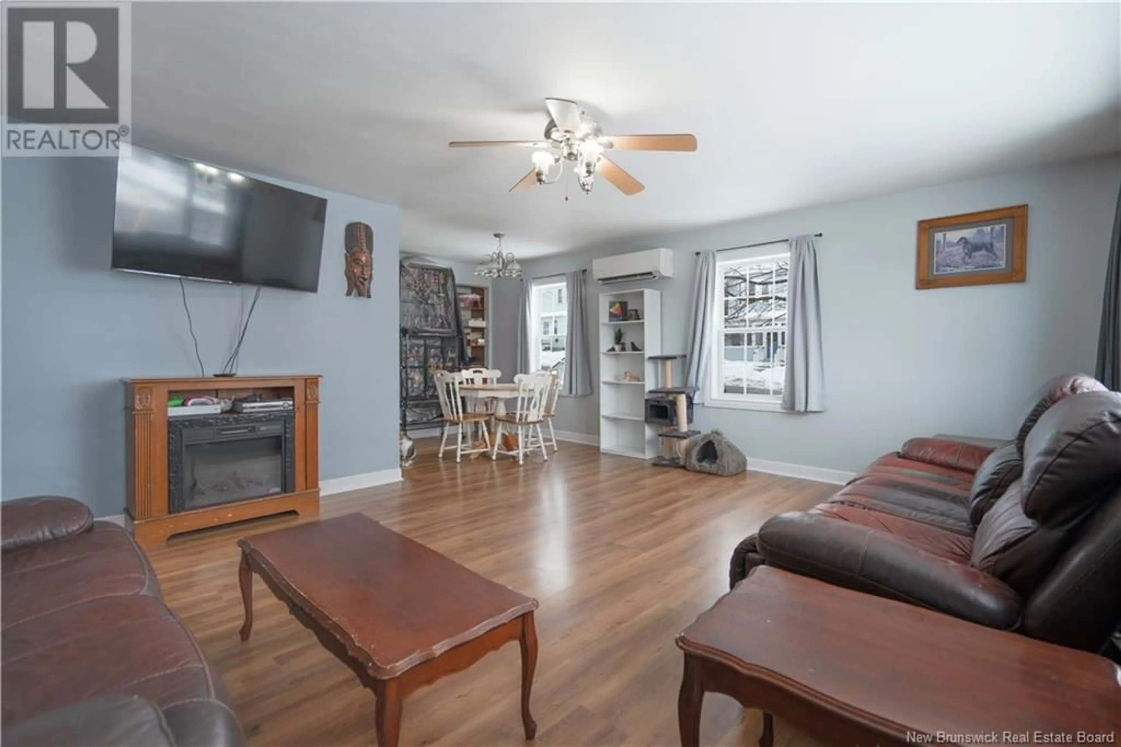 Living room with furniture, wood/laminate floor for 813 Bleury Street, Saint John New Brunswick E2M3H6