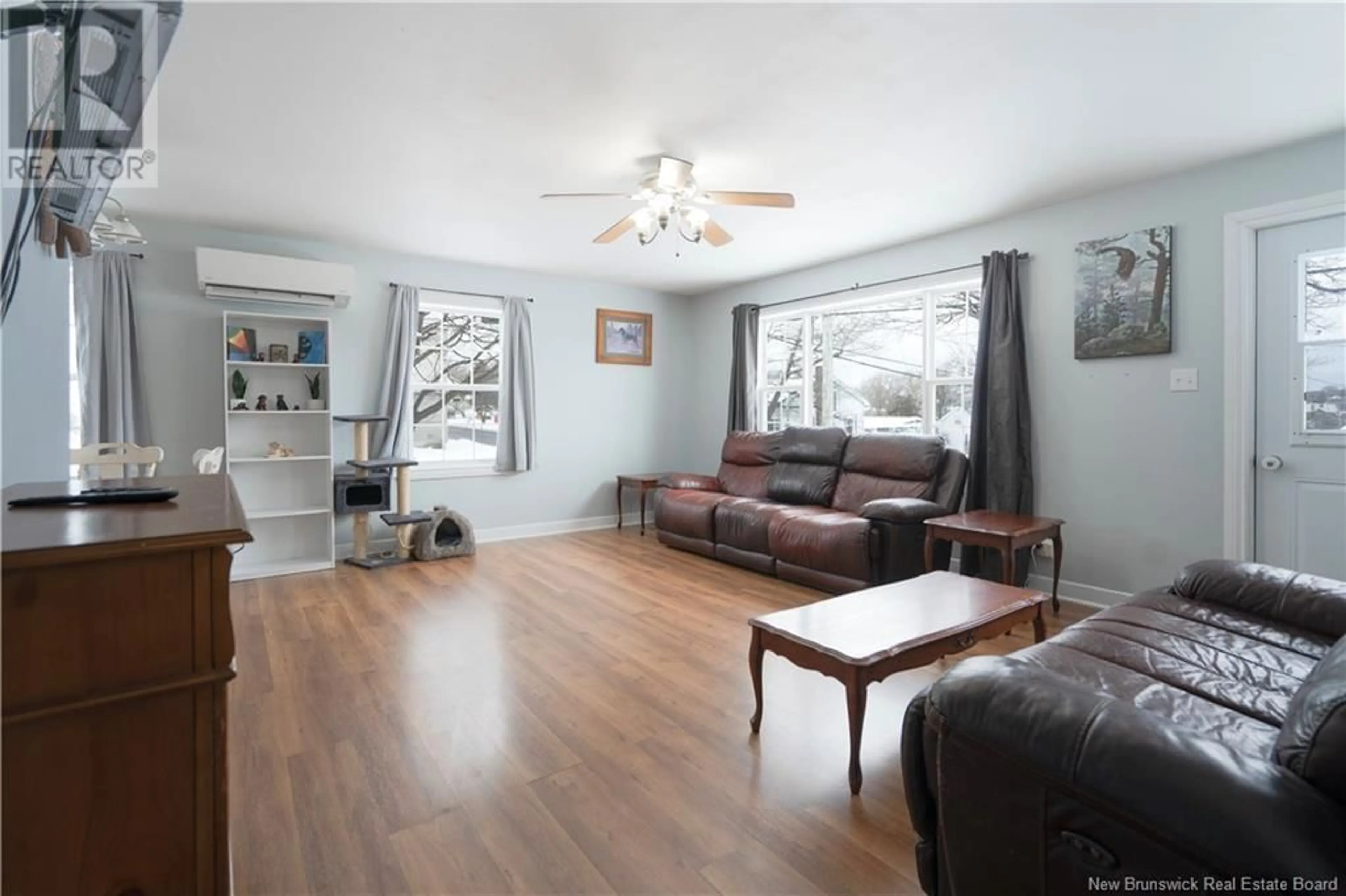 Living room with furniture, wood/laminate floor for 813 Bleury Street, Saint John New Brunswick E2M3H6