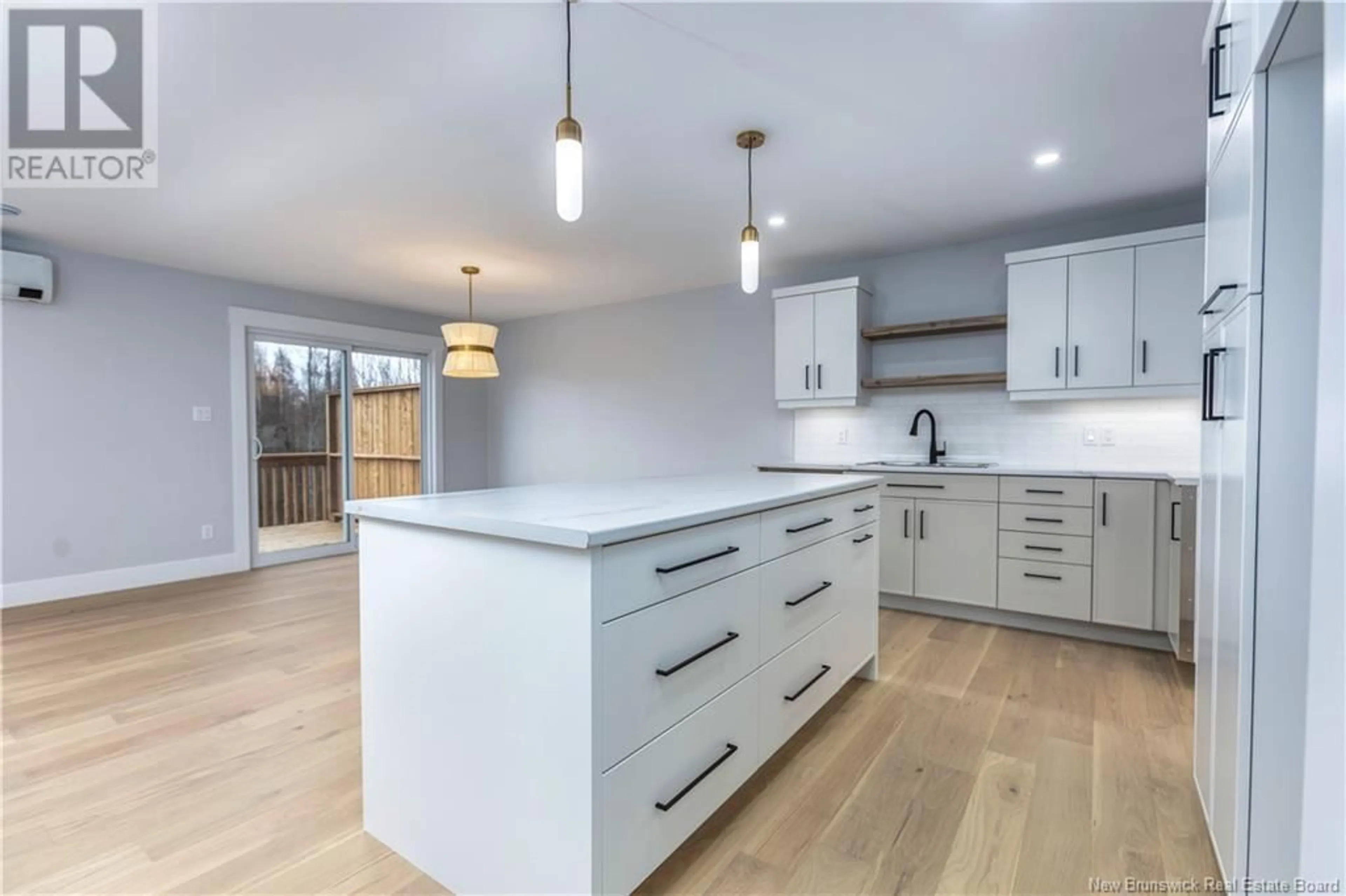 Open concept kitchen, wood/laminate floor for 48 Belfry Street, Moncton New Brunswick E1G5B6