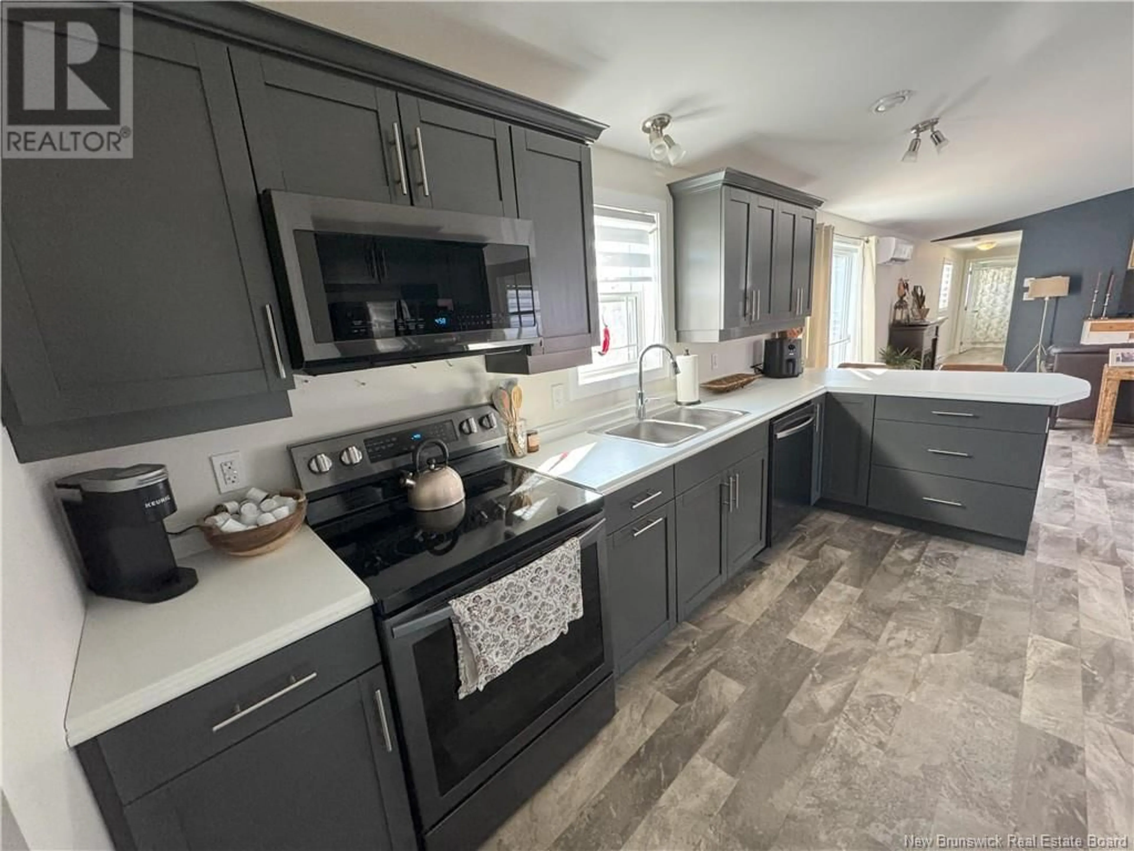 Open concept kitchen, ceramic/tile floor for 43 Ivory Court, Woodstock New Brunswick E7M0G5