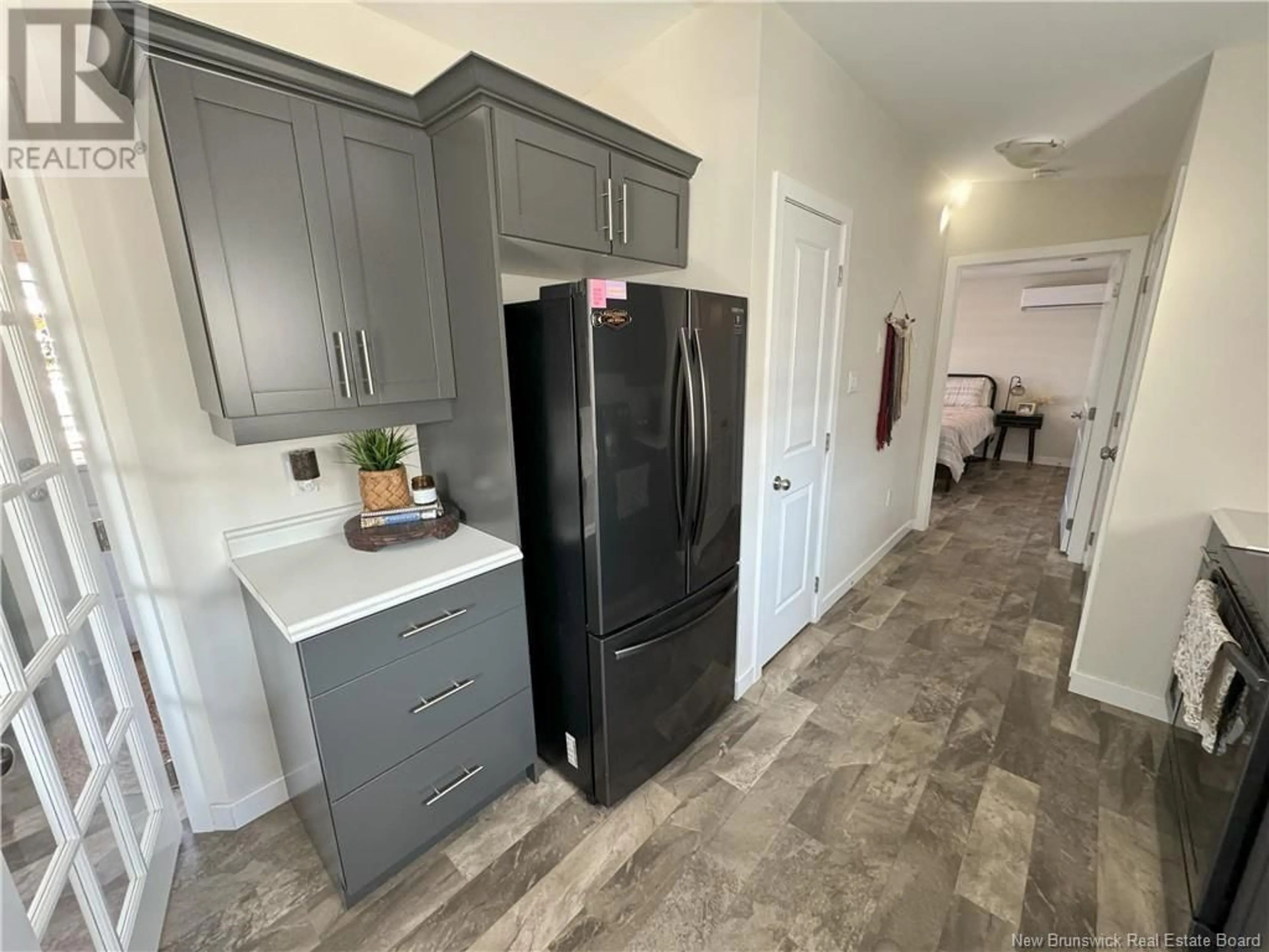 Open concept kitchen, ceramic/tile floor for 43 Ivory Court, Woodstock New Brunswick E7M0G5