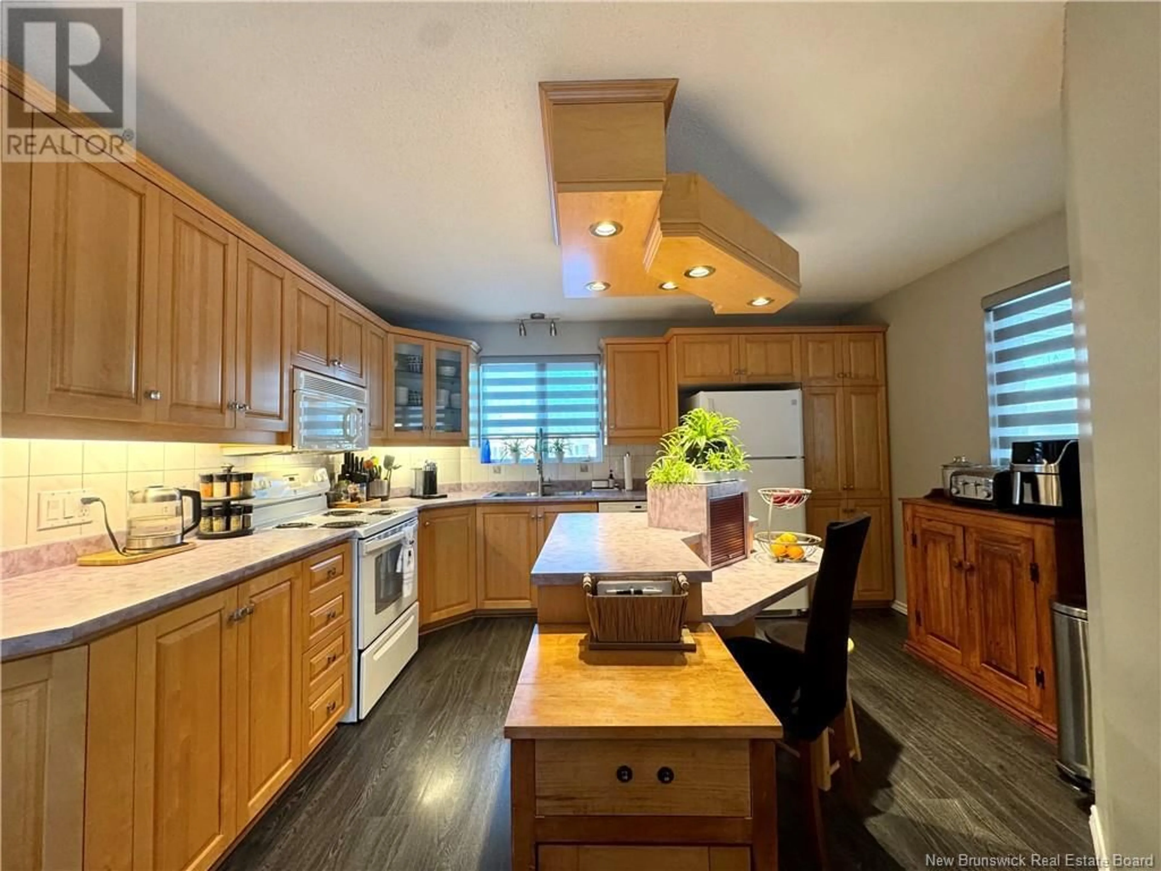 Open concept kitchen, wood/laminate floor for 280 DU POUVOIR ROAD, Edmundston New Brunswick E3V2Y7