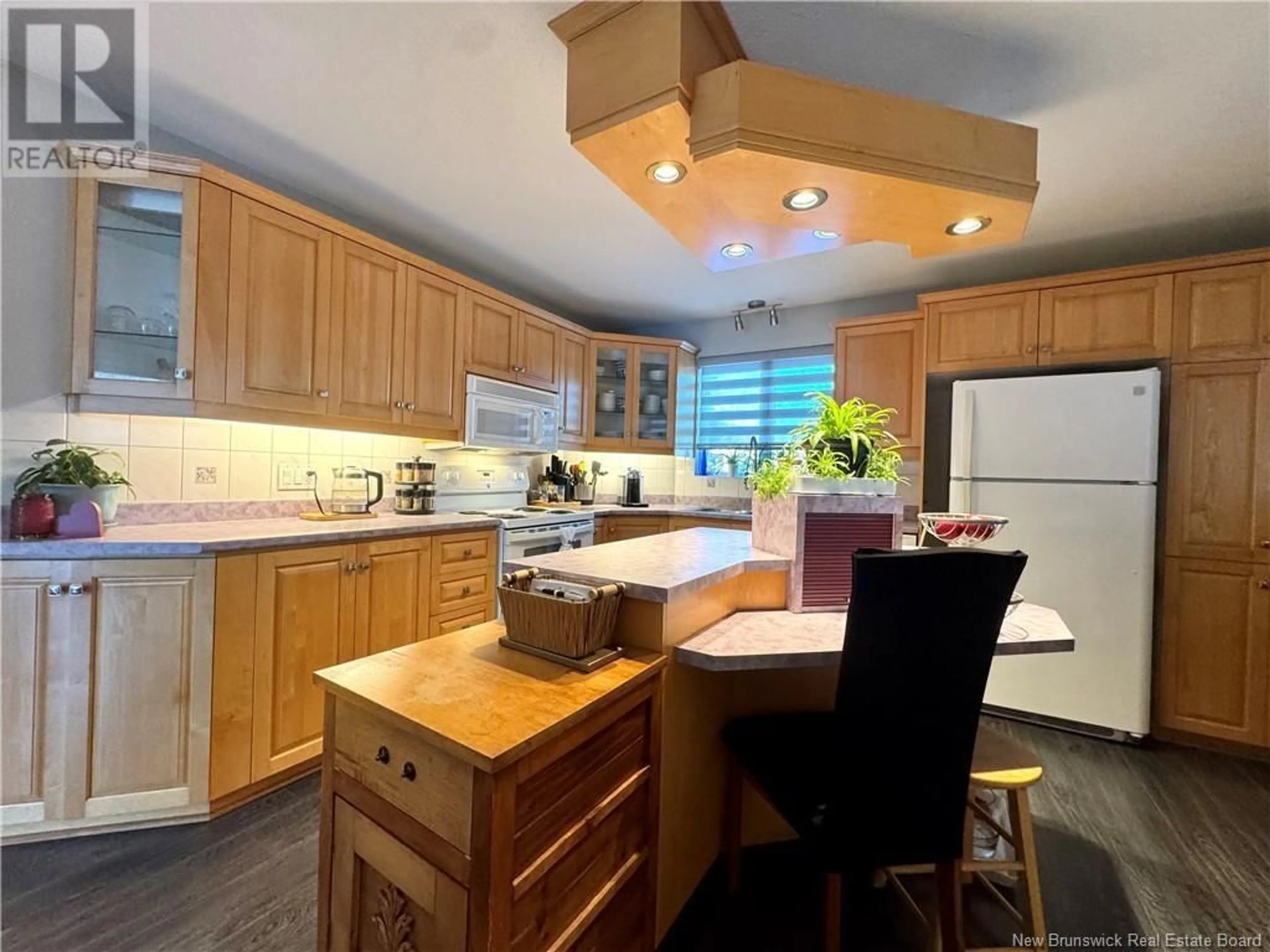 Open concept kitchen, wood/laminate floor for 280 DU POUVOIR ROAD, Edmundston New Brunswick E3V2Y7