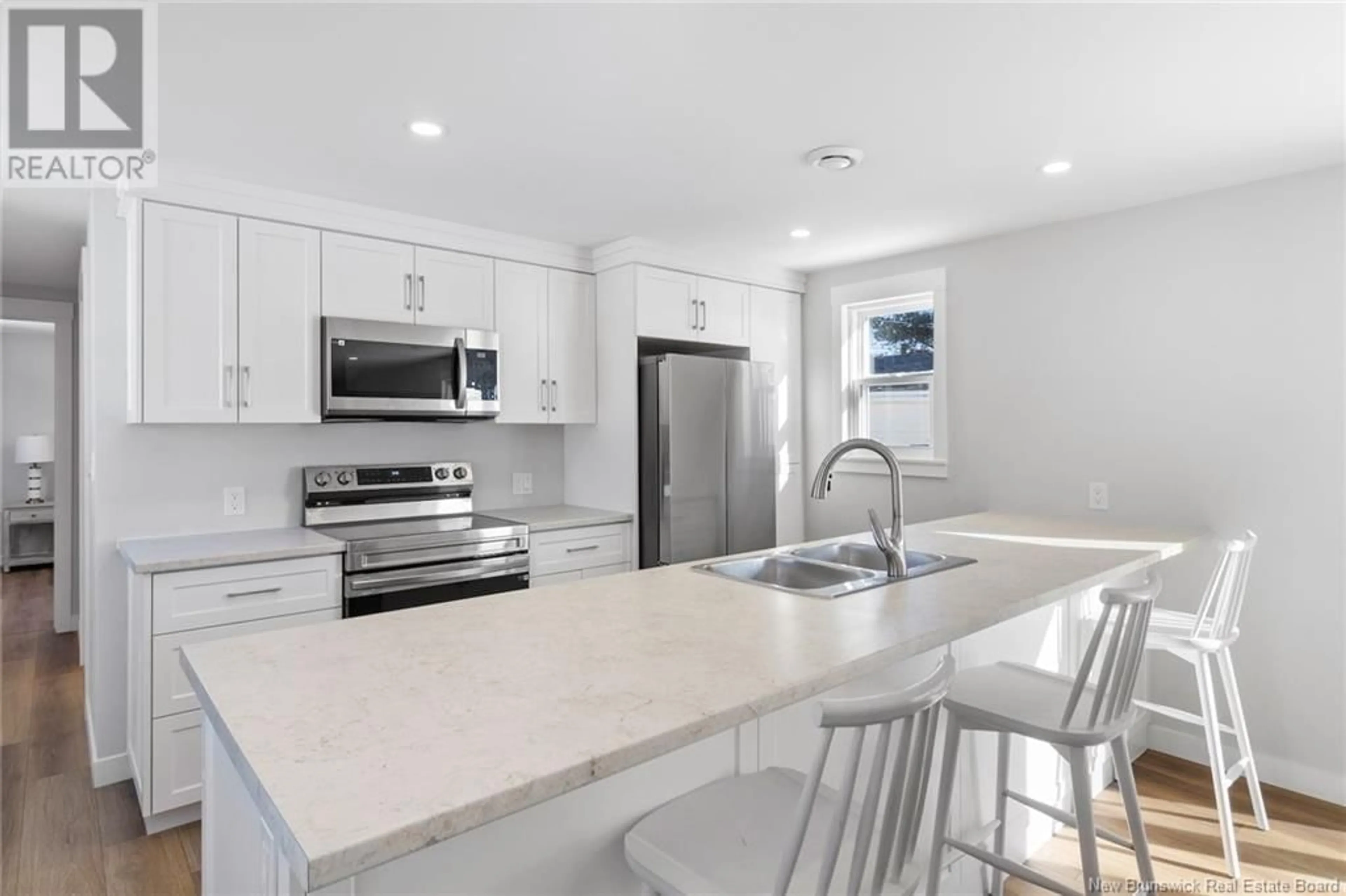 Open concept kitchen, ceramic/tile floor for 22 Northwood, Hanwell New Brunswick E3B6R3