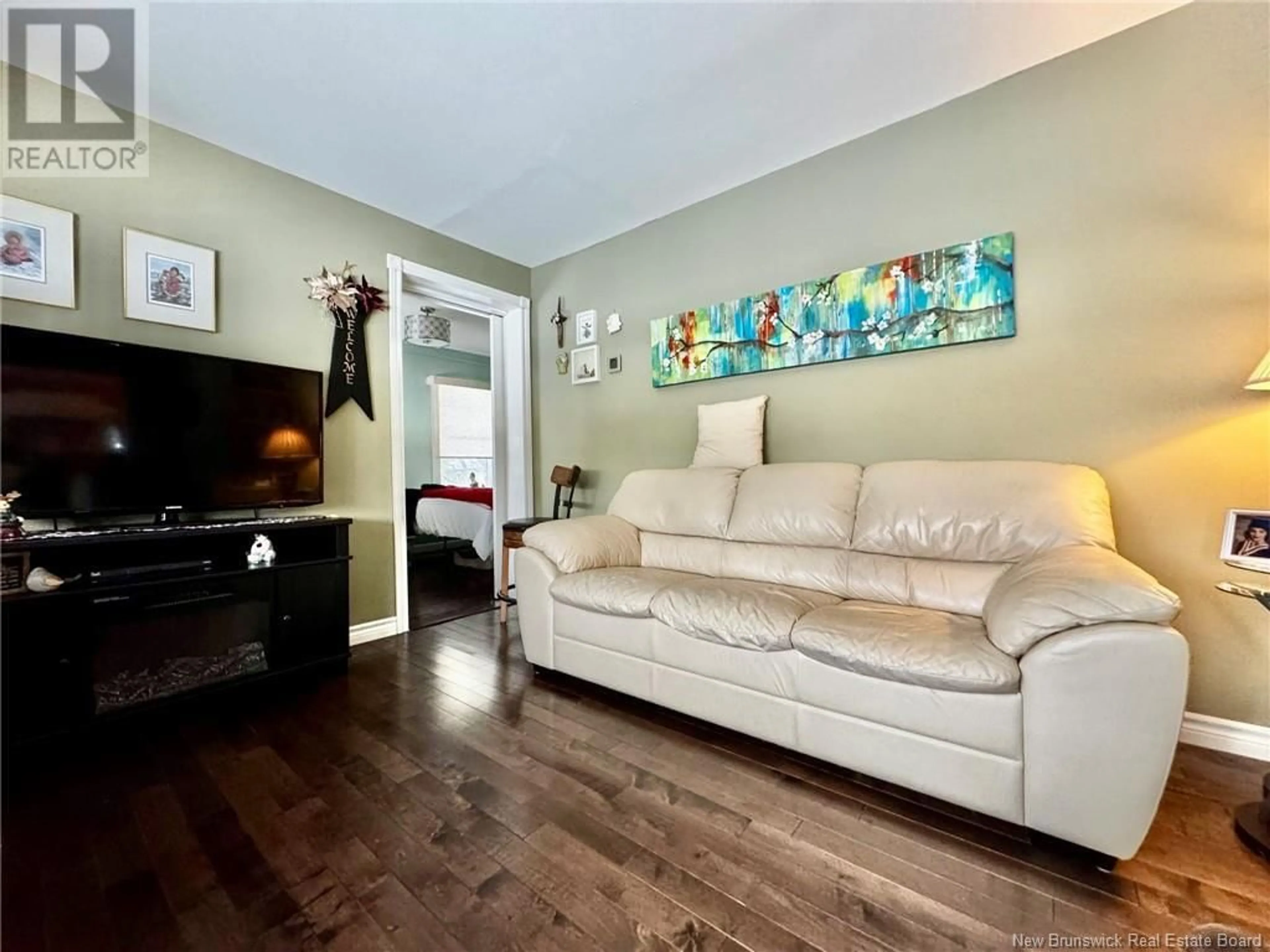 Living room with furniture, wood/laminate floor for 242 Northwest Road, Sunny Corner New Brunswick E9E1K8