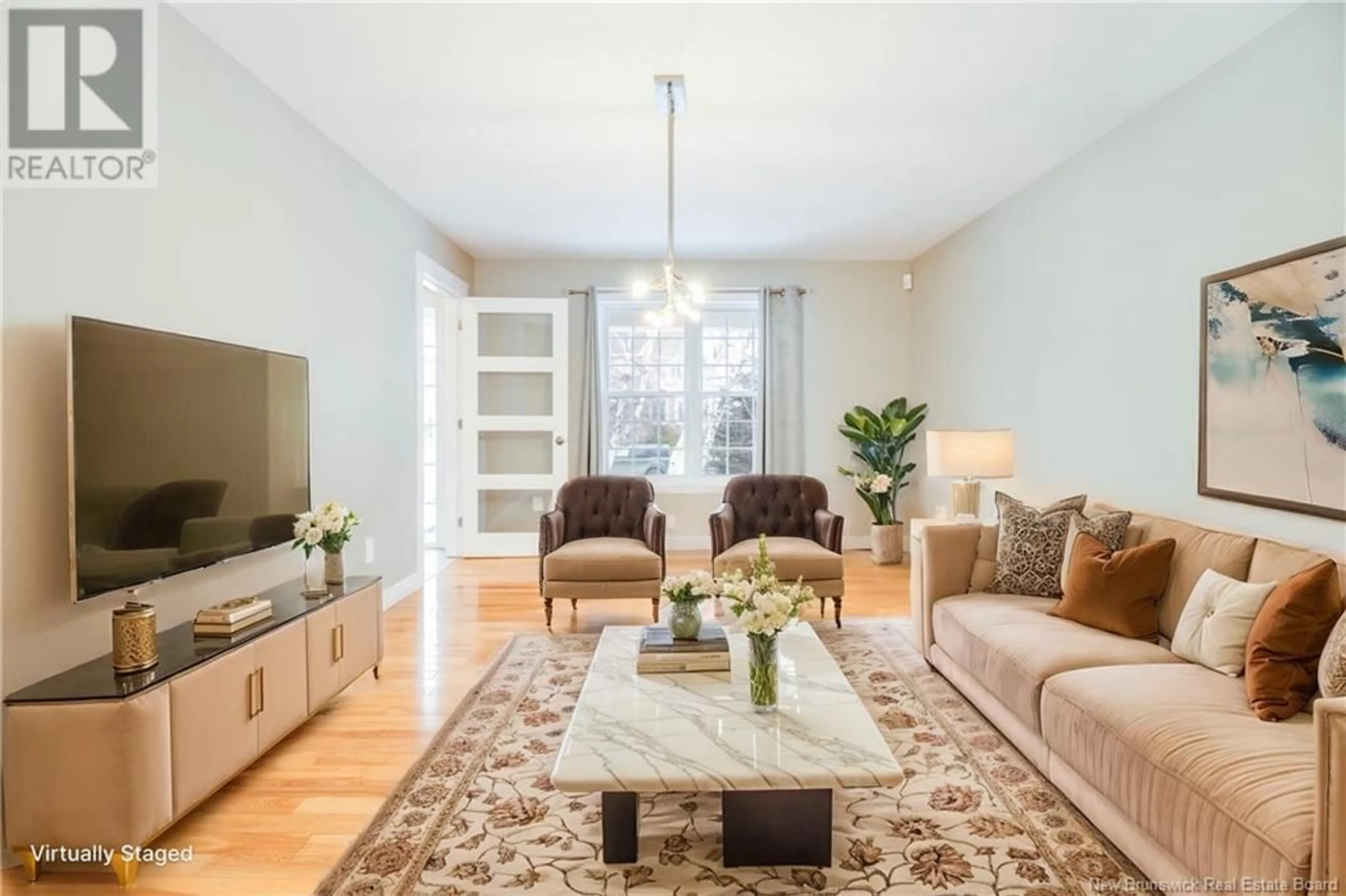 Living room with furniture, wood/laminate floor for 69 Bliss Carman Drive, Fredericton New Brunswick E3B9P2