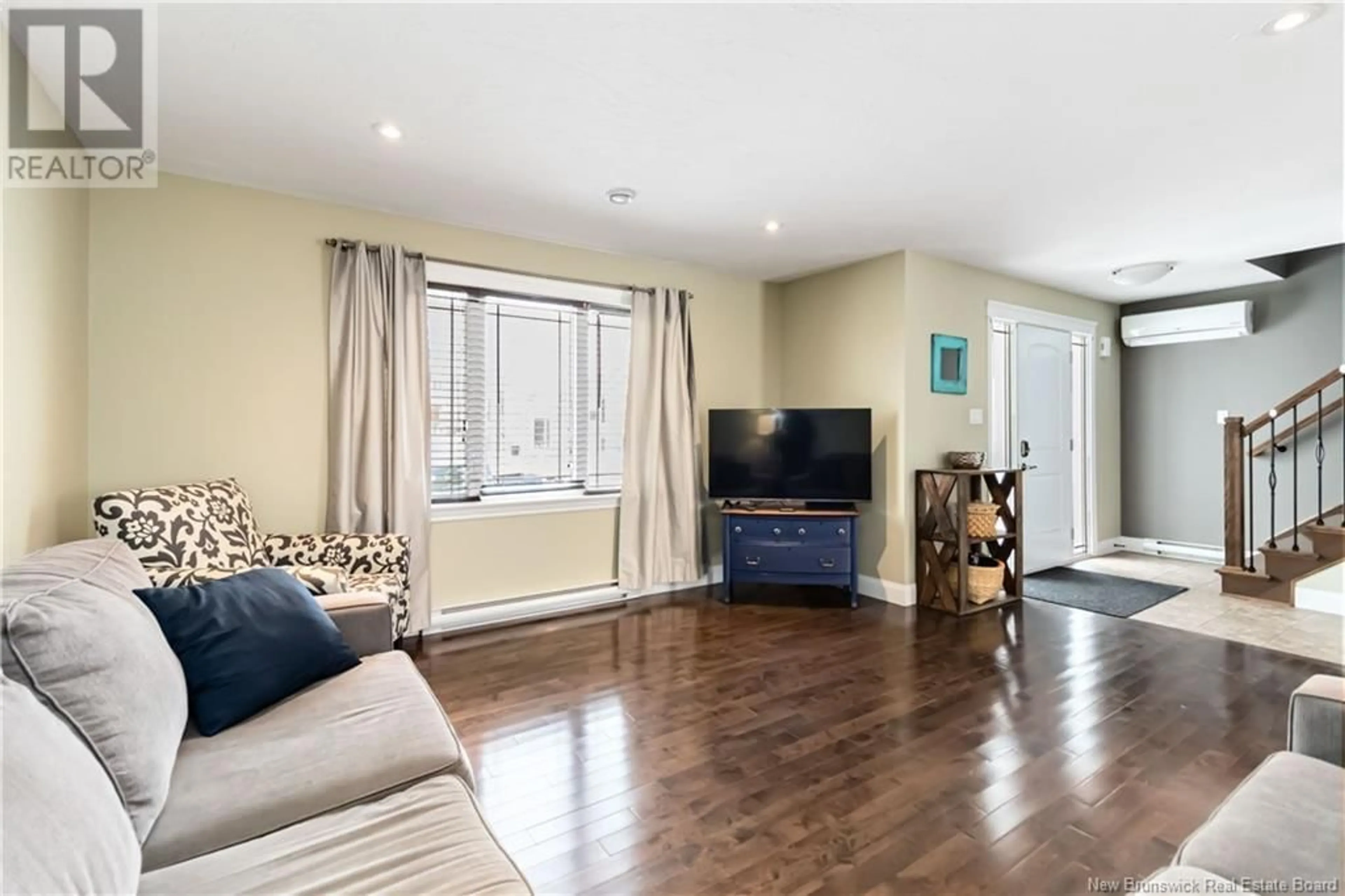 Living room with furniture, wood/laminate floor for 11 edington Street, Moncton New Brunswick E1E0G5