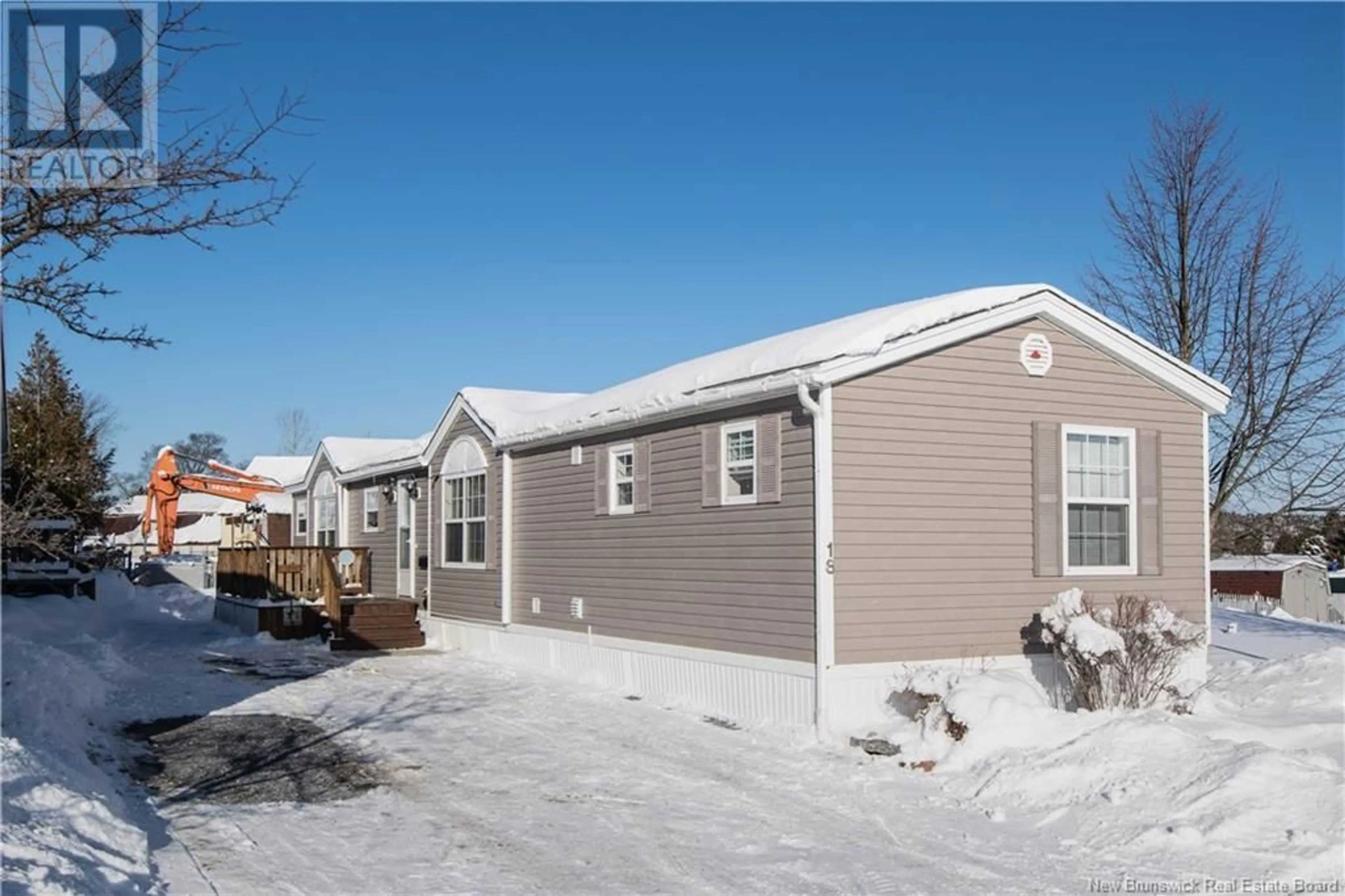 Home with vinyl exterior material, street for 18 Quail Street, Saint John New Brunswick E2J5A2