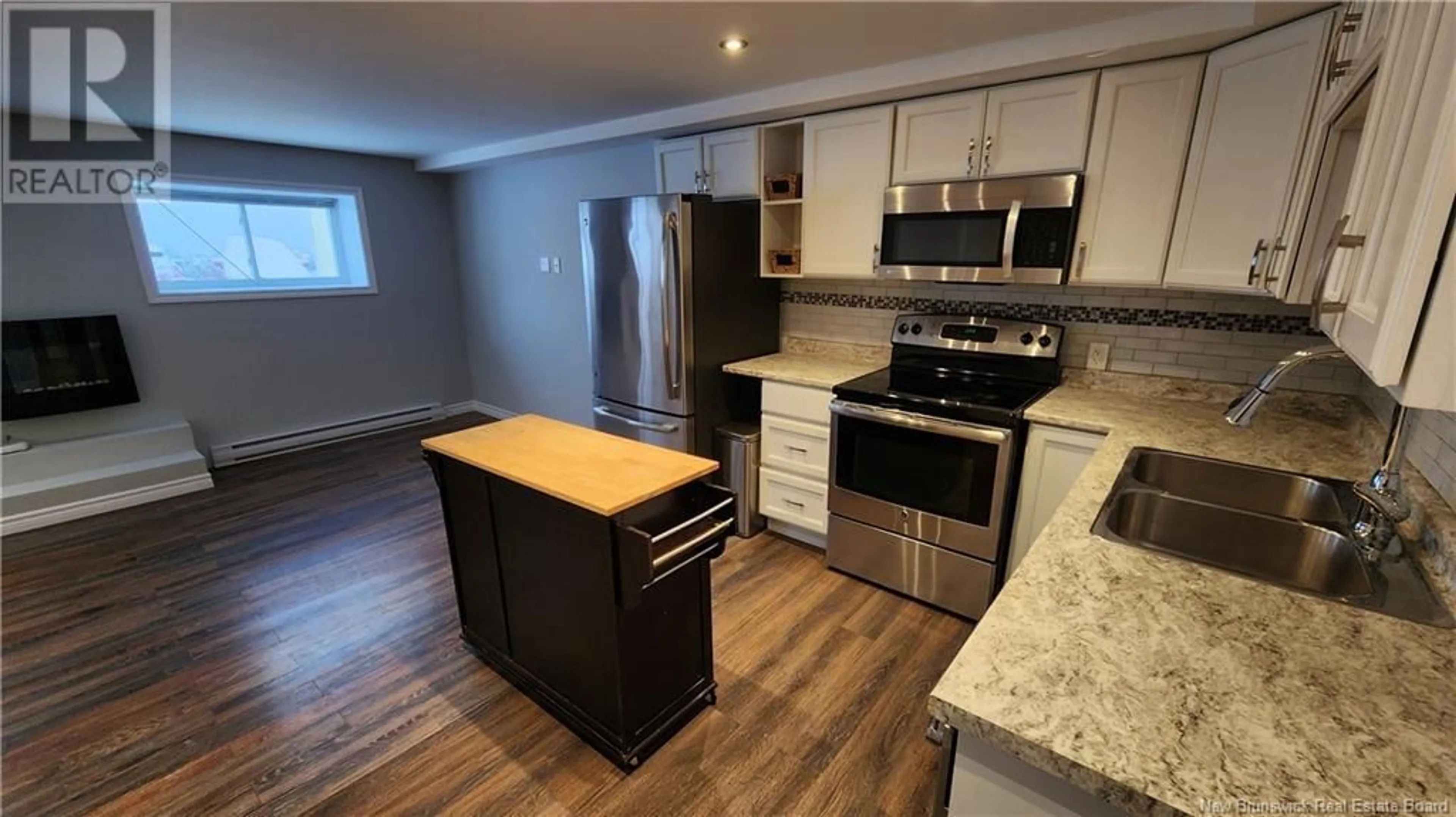 Open concept kitchen, wood/laminate floor for 500 Douglas Avenue Unit# B7, Saint John New Brunswick E2K1E7