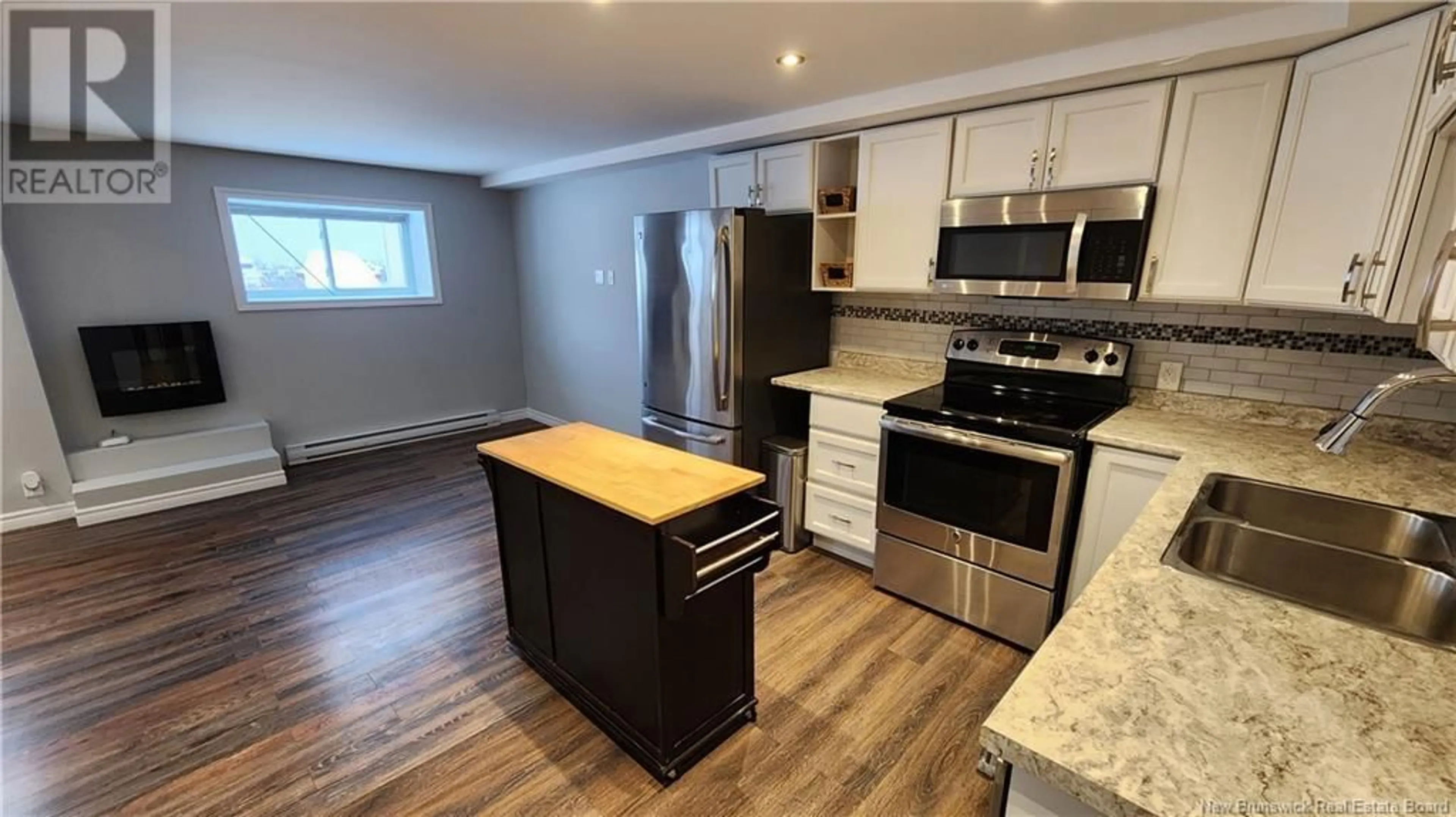 Open concept kitchen, wood/laminate floor for 500 Douglas Avenue Unit# B7, Saint John New Brunswick E2K1E7