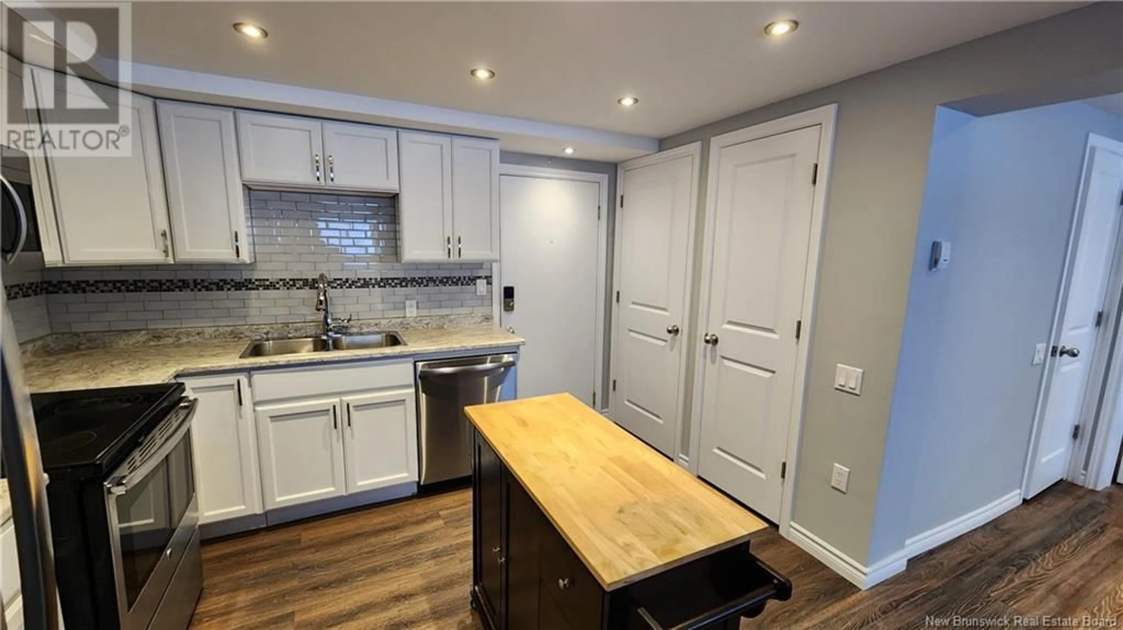 Open concept kitchen, wood/laminate floor for 500 Douglas Avenue Unit# B7, Saint John New Brunswick E2K1E7