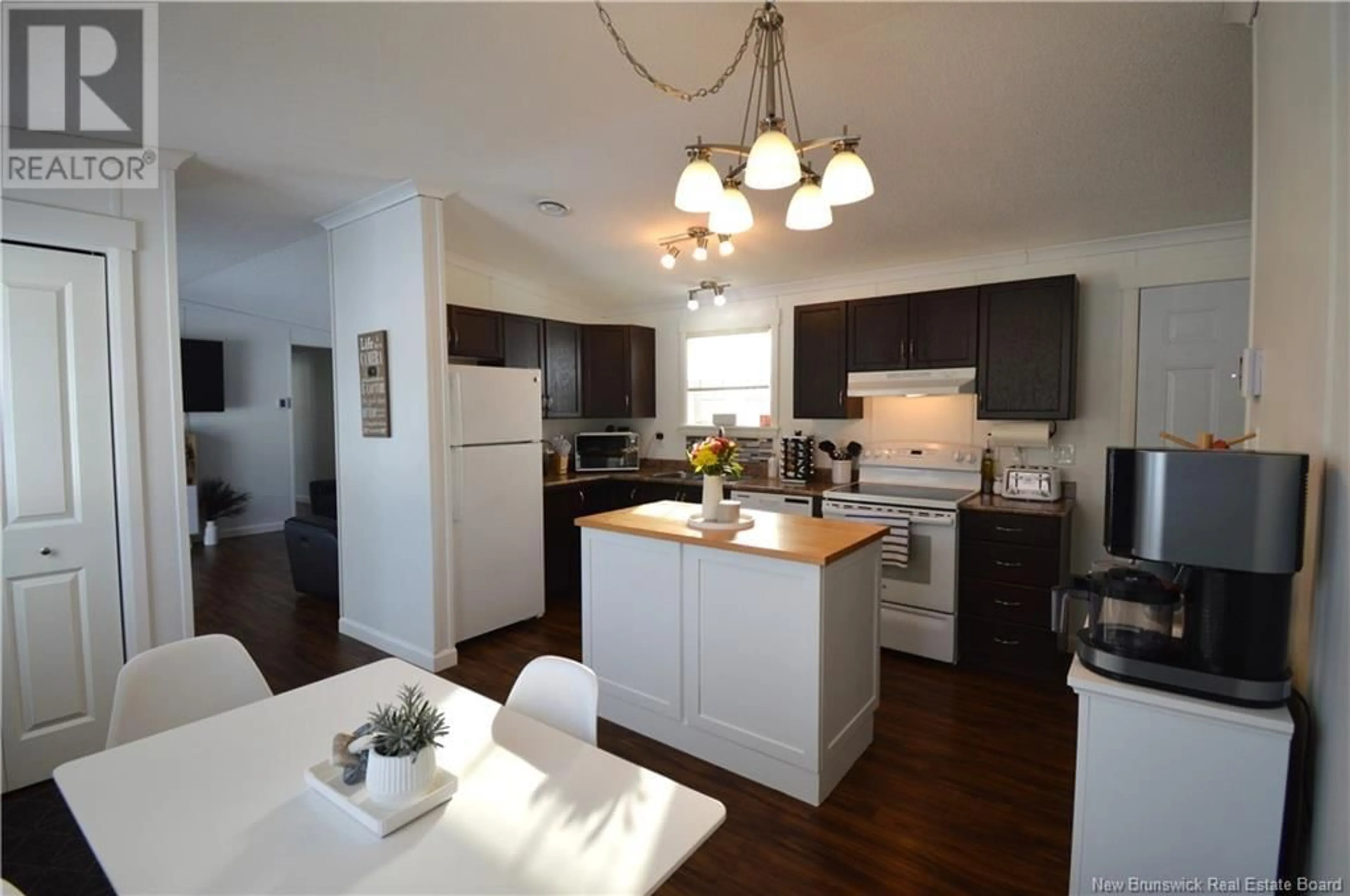 Open concept kitchen, wood/laminate floor for 53 Perrot Street, Shediac New Brunswick E4P0H3