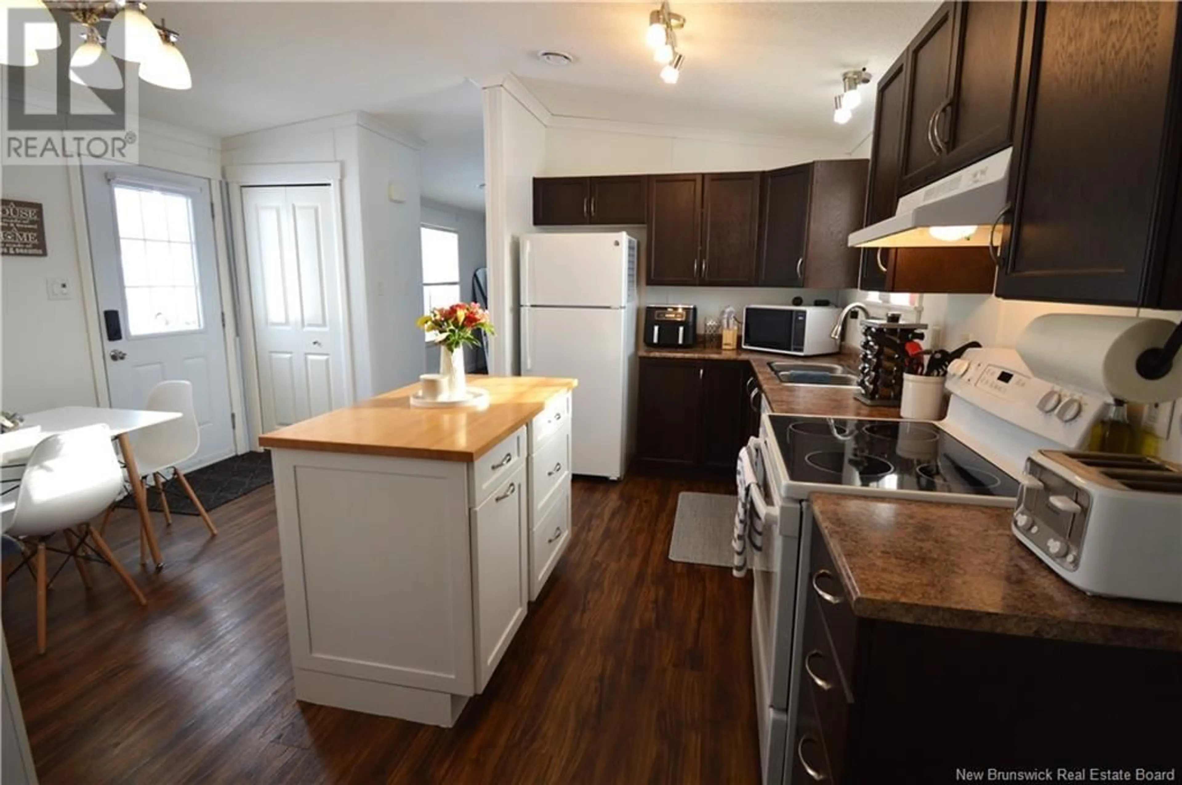 Open concept kitchen, wood/laminate floor for 53 Perrot Street, Shediac New Brunswick E4P0H3