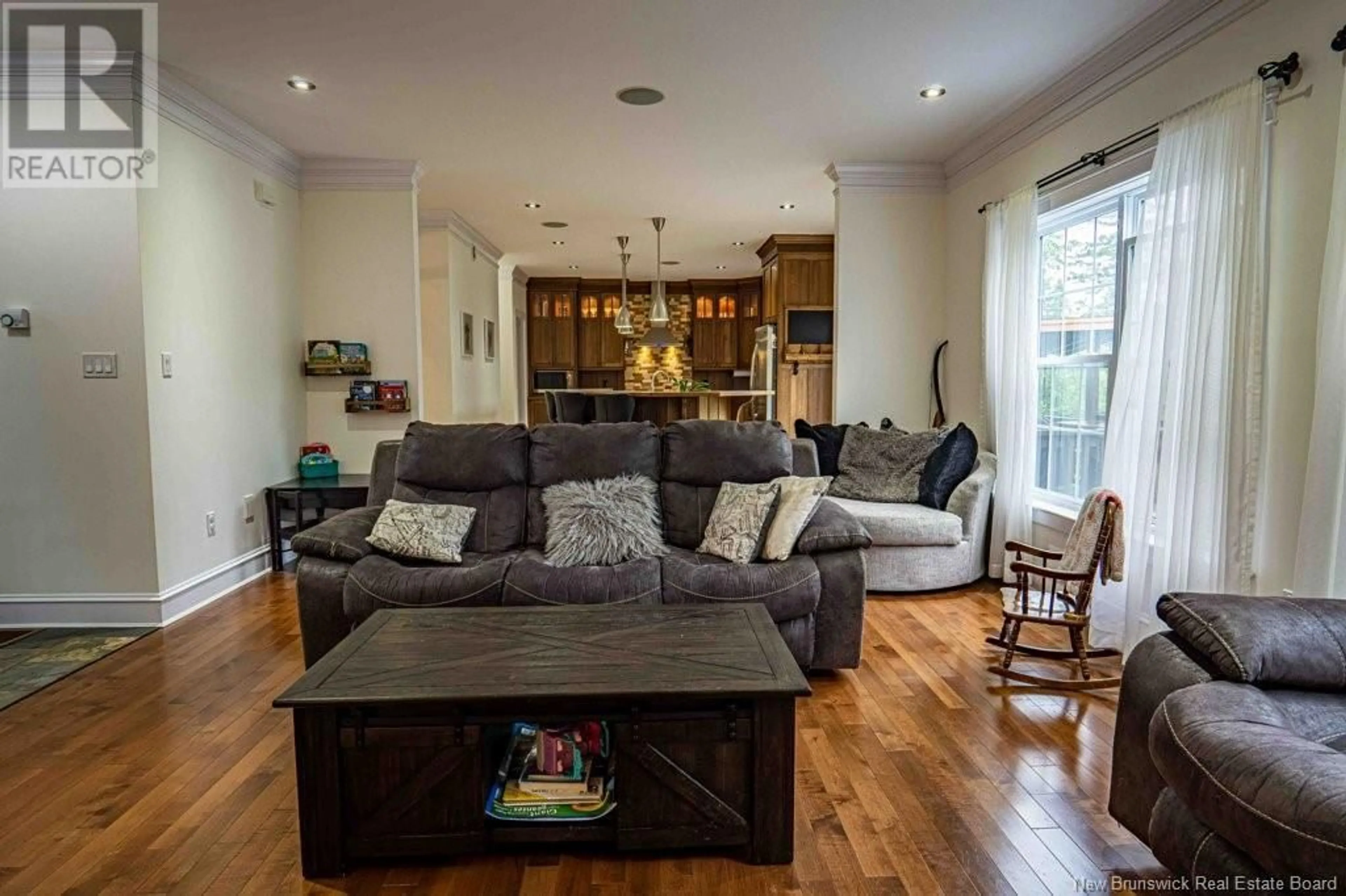 Living room with furniture, wood/laminate floor for 4 Blue Jay Court, Hanwell New Brunswick E3B0H3