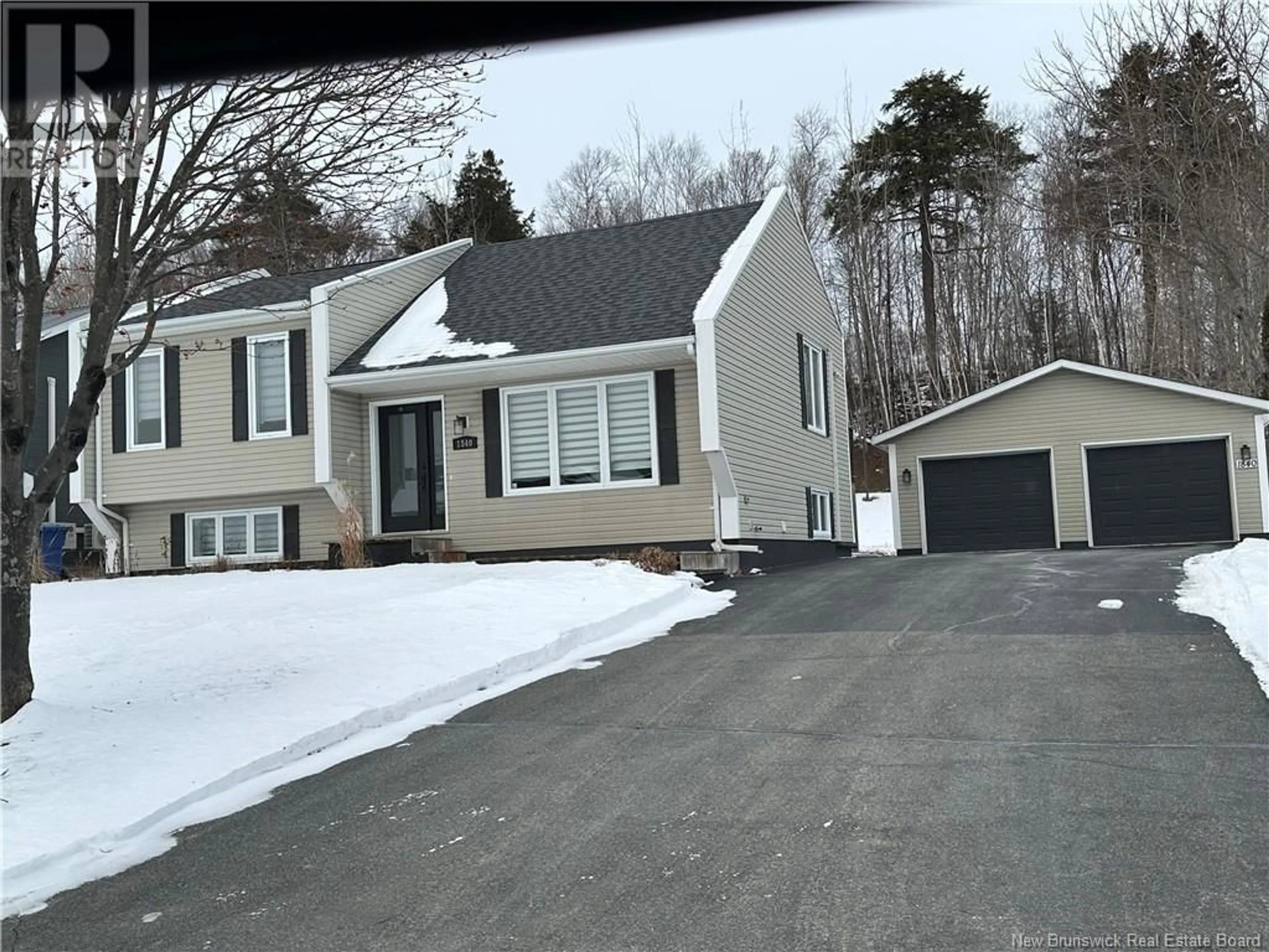 Home with vinyl exterior material, street for 1840 Gowan Brae, Bathurst New Brunswick E2A4X5