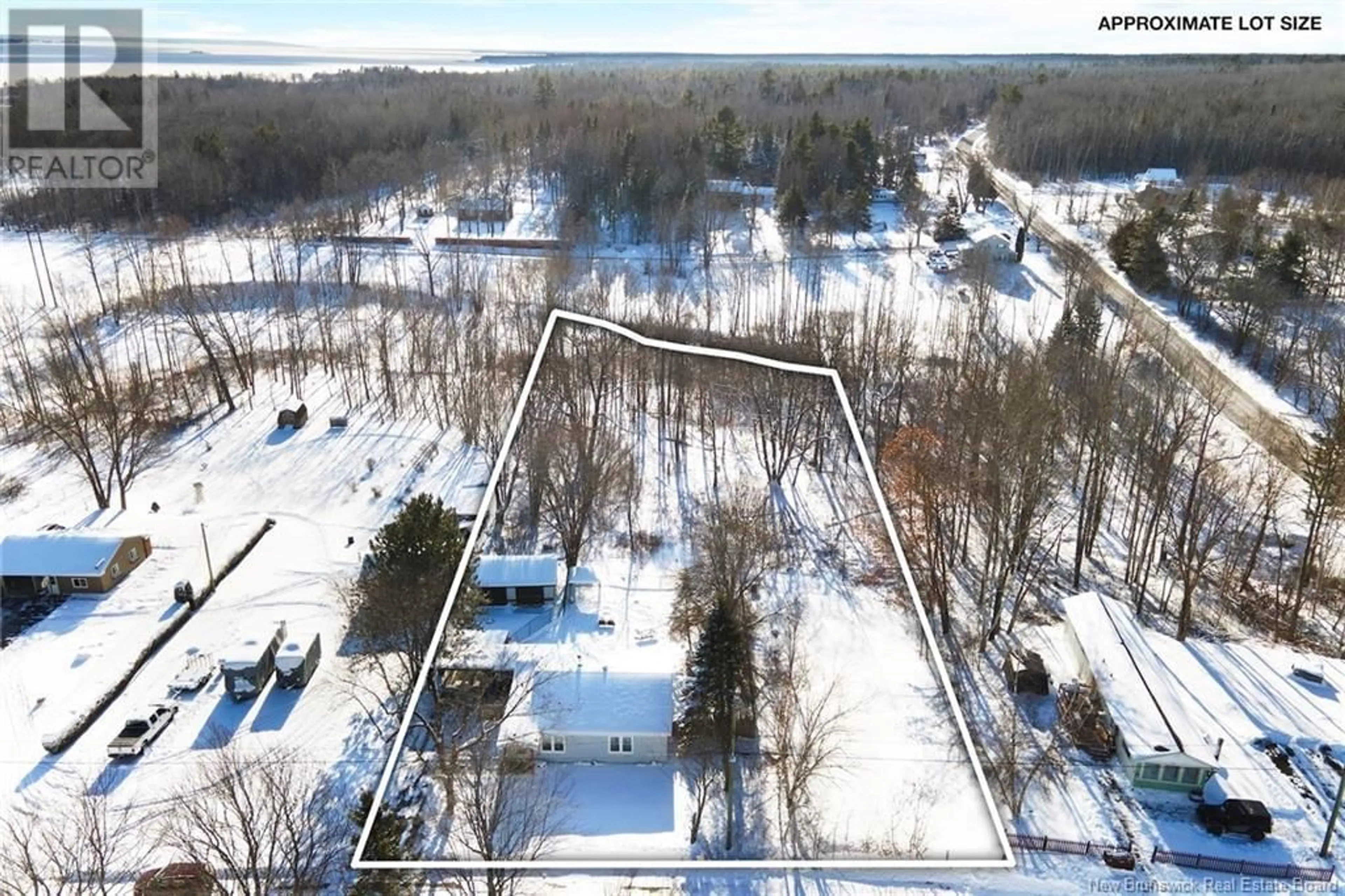 A pic from outside/outdoor area/front of a property/back of a property/a pic from drone, unknown for 8 Wharf Road, Newcastle Creek New Brunswick E4B2J7