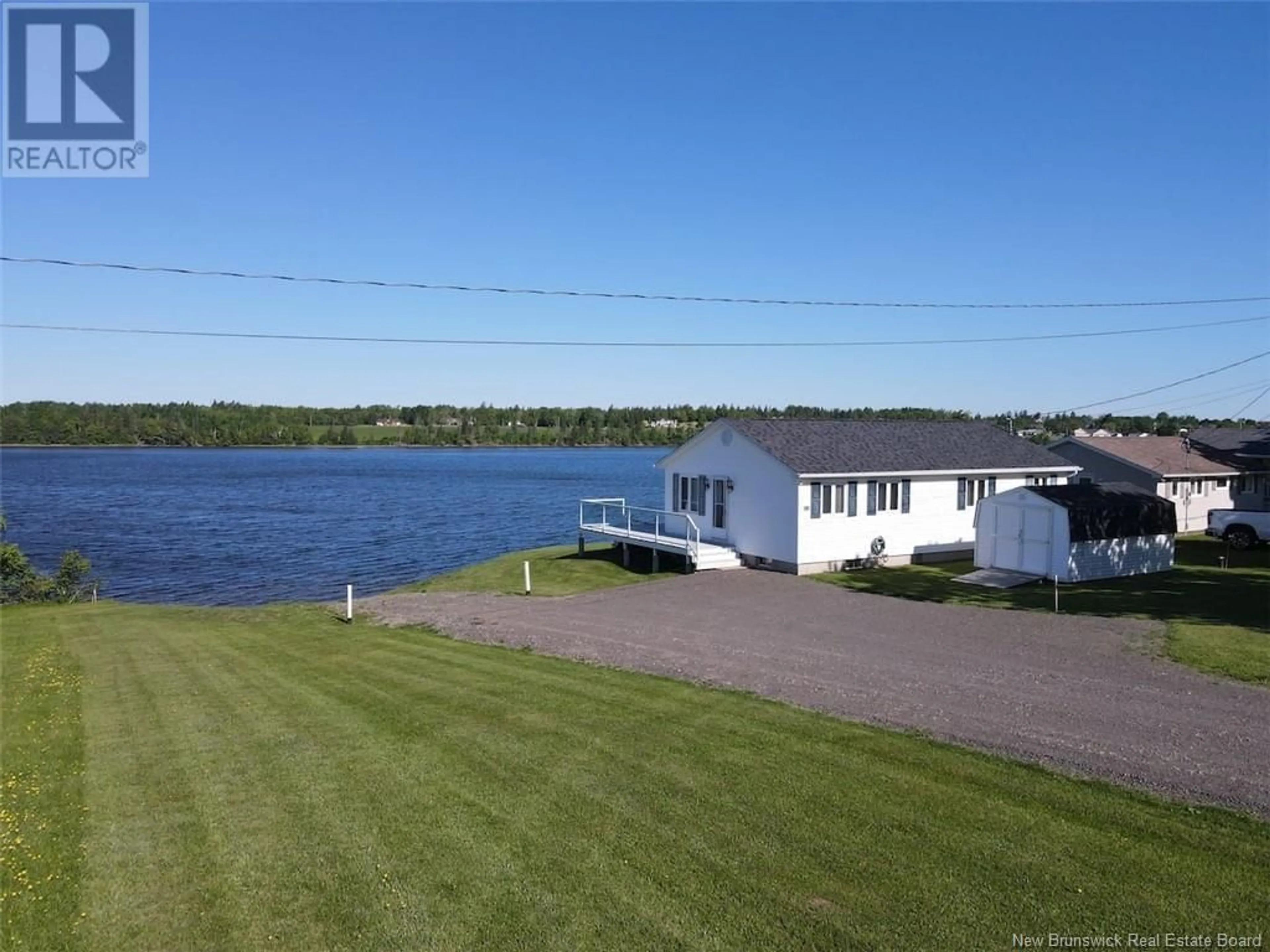 A pic from outside/outdoor area/front of a property/back of a property/a pic from drone, water/lake/river/ocean view for 33 Lionel Road, Bouctouche New Brunswick E4S5L7