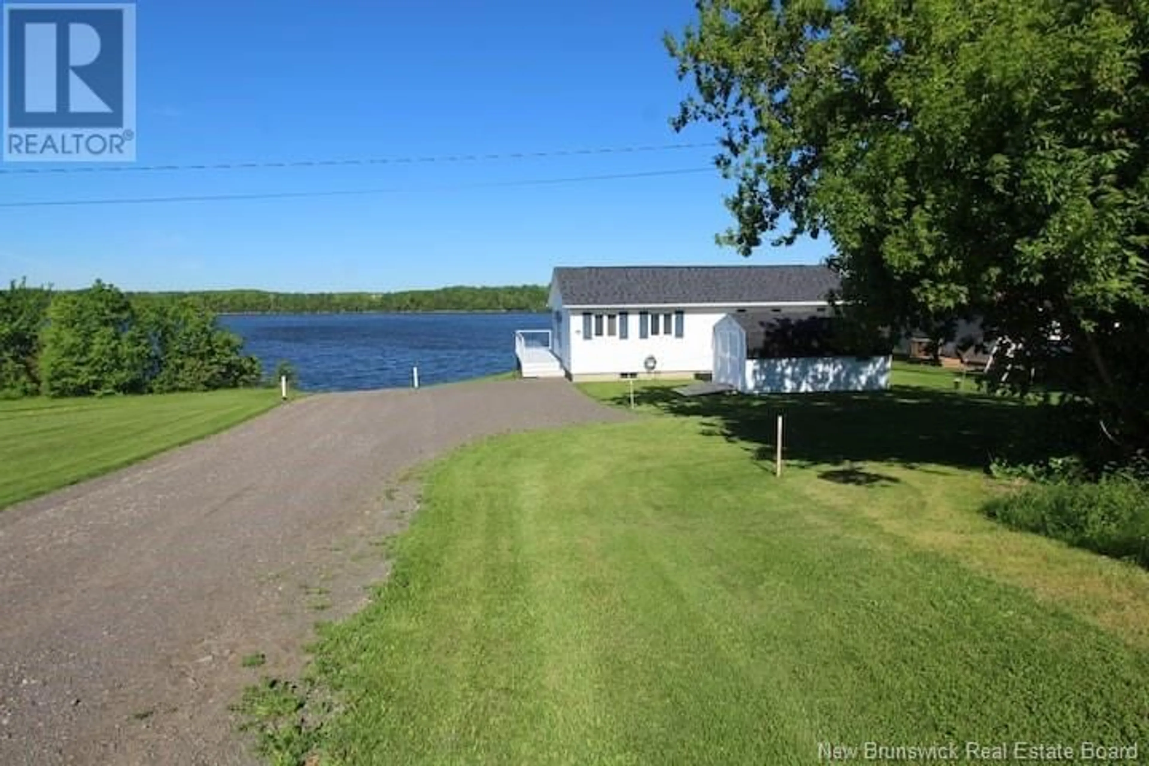 A pic from outside/outdoor area/front of a property/back of a property/a pic from drone, water/lake/river/ocean view for 33 Lionel Road, Bouctouche New Brunswick E4S5L7