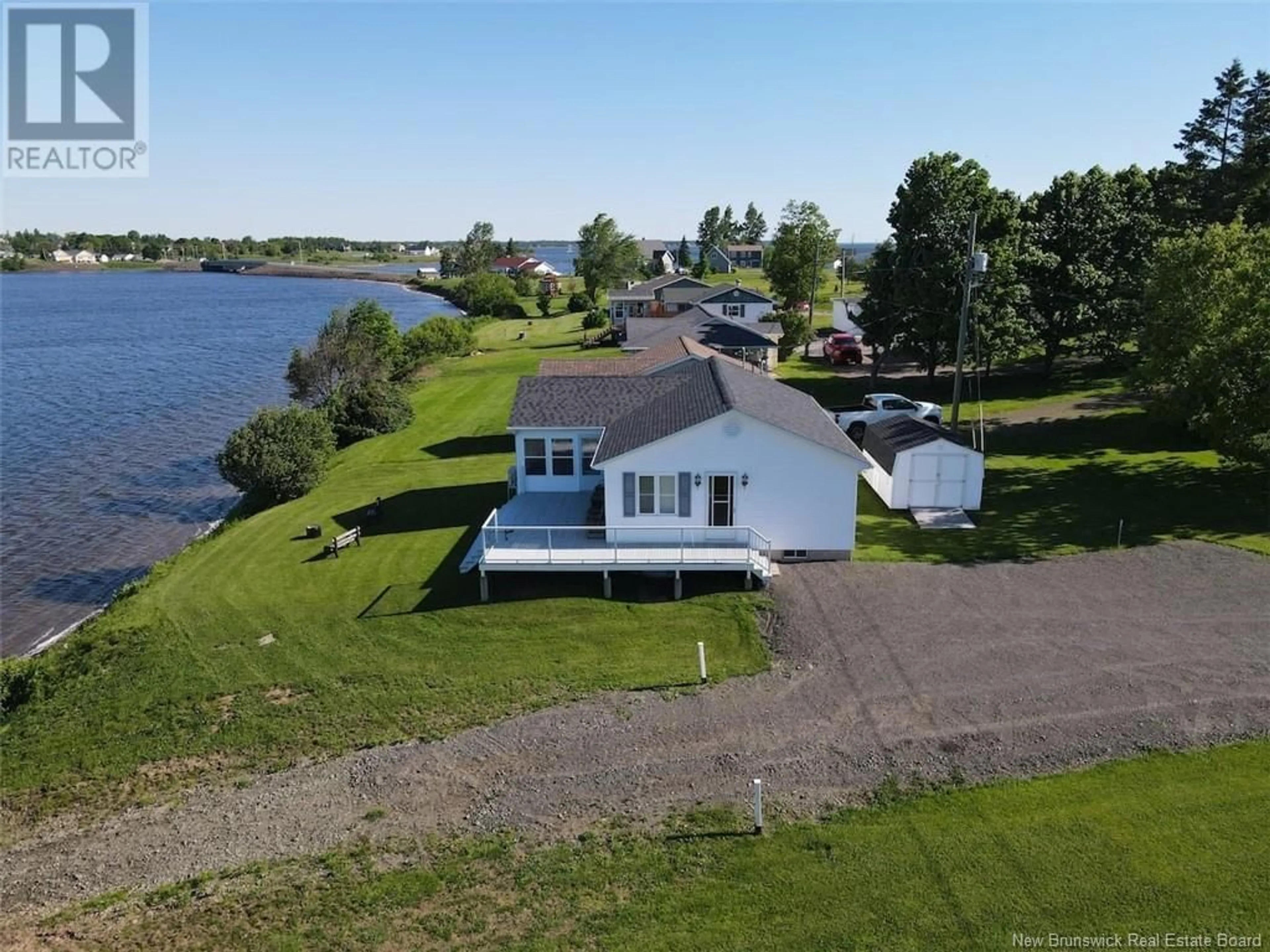 A pic from outside/outdoor area/front of a property/back of a property/a pic from drone, water/lake/river/ocean view for 33 Lionel Road, Bouctouche New Brunswick E4S5L7