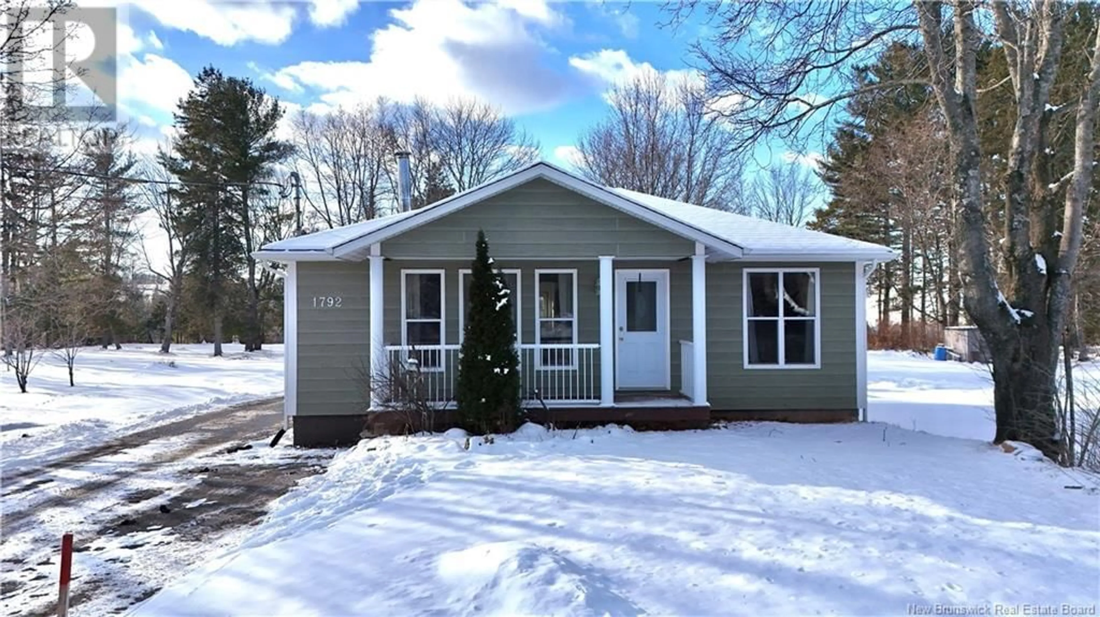 Home with vinyl exterior material, street for 1792 Rough Waters Drive, Bathurst New Brunswick E2A1Z8