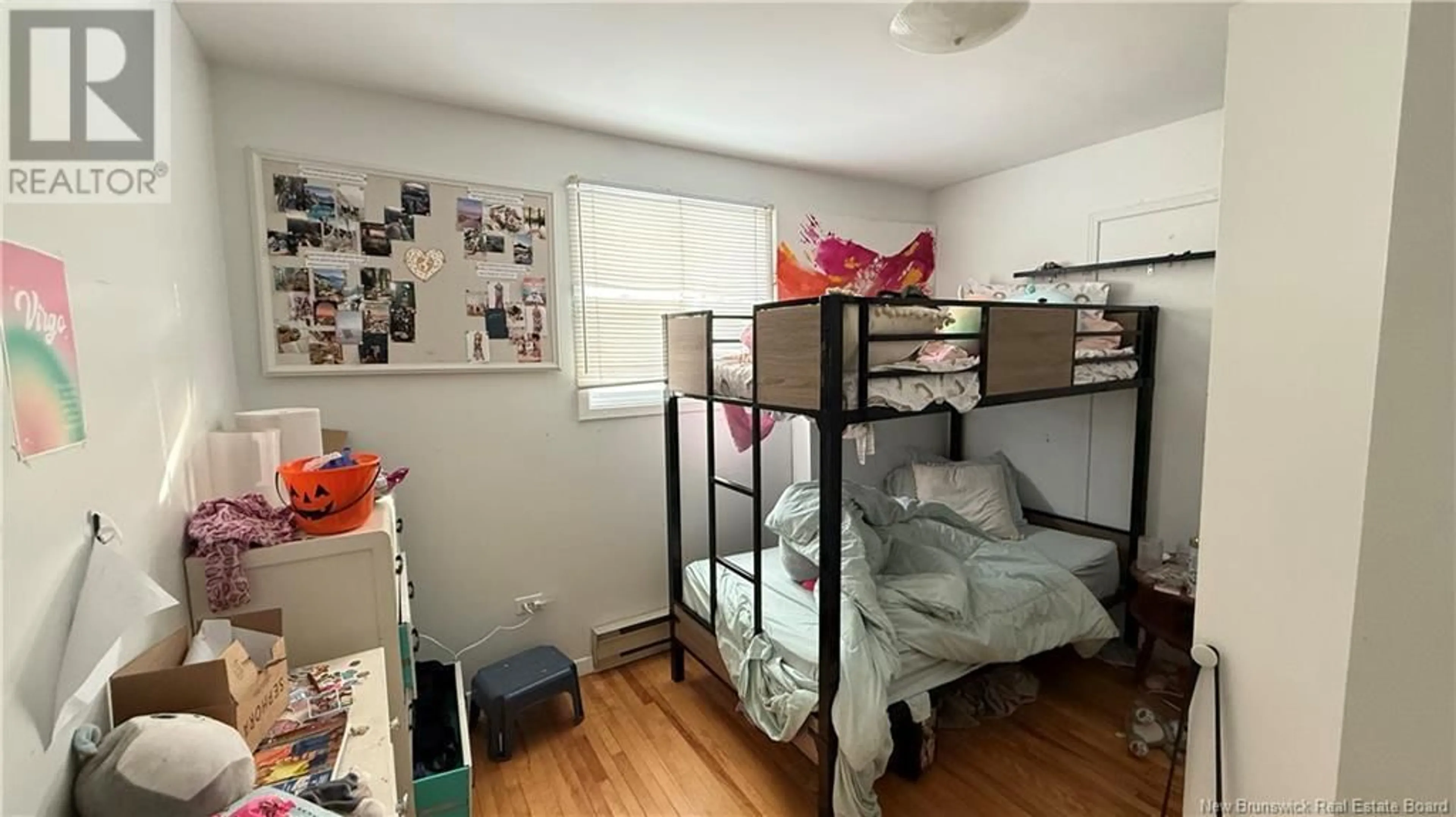 Living room with furniture, wood/laminate floor for 86 JONES STREET, Moncton New Brunswick E1C6J6