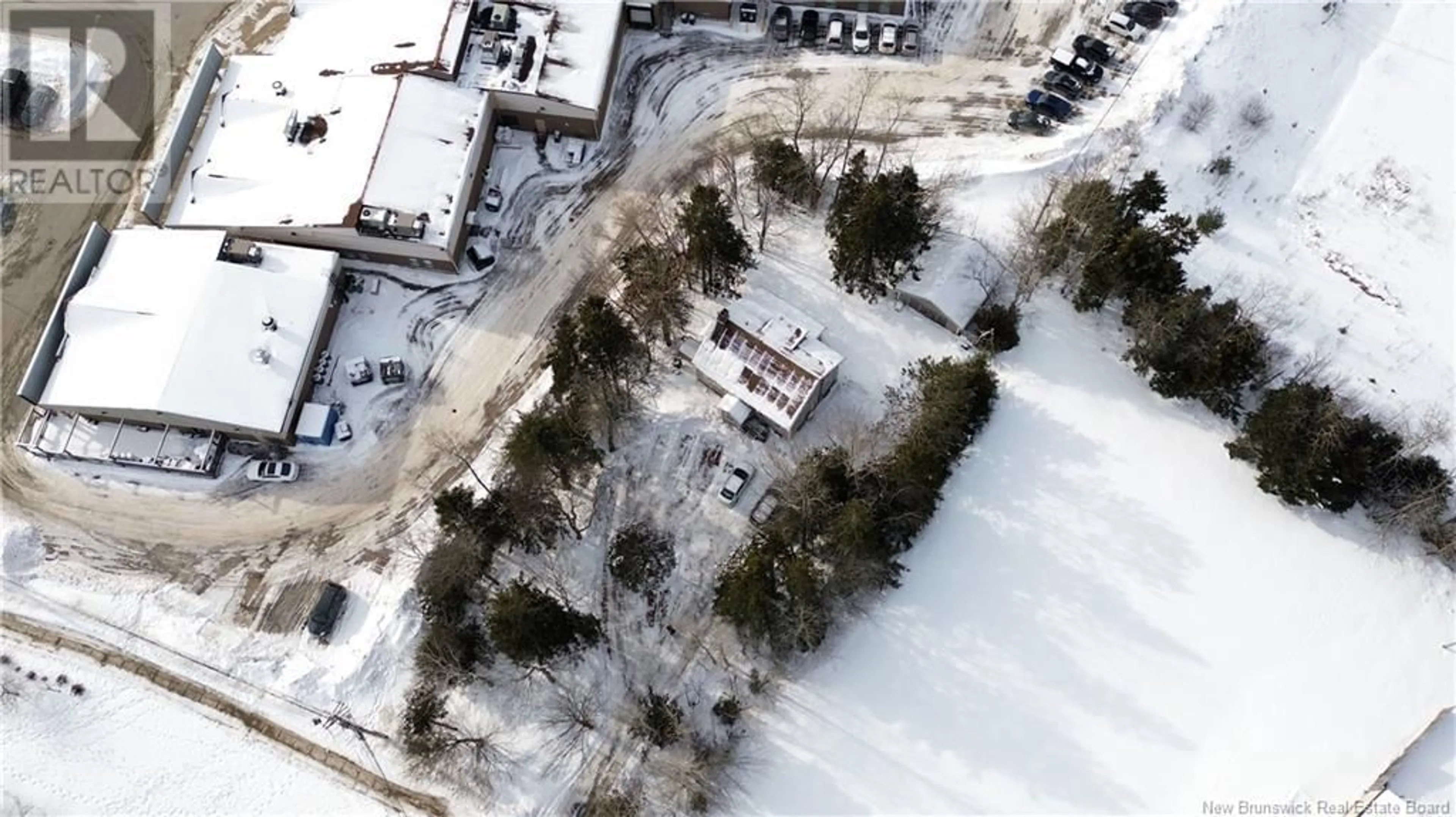 A pic from outside/outdoor area/front of a property/back of a property/a pic from drone, street for 7 Lila Court, Quispamsis New Brunswick E2E3R5